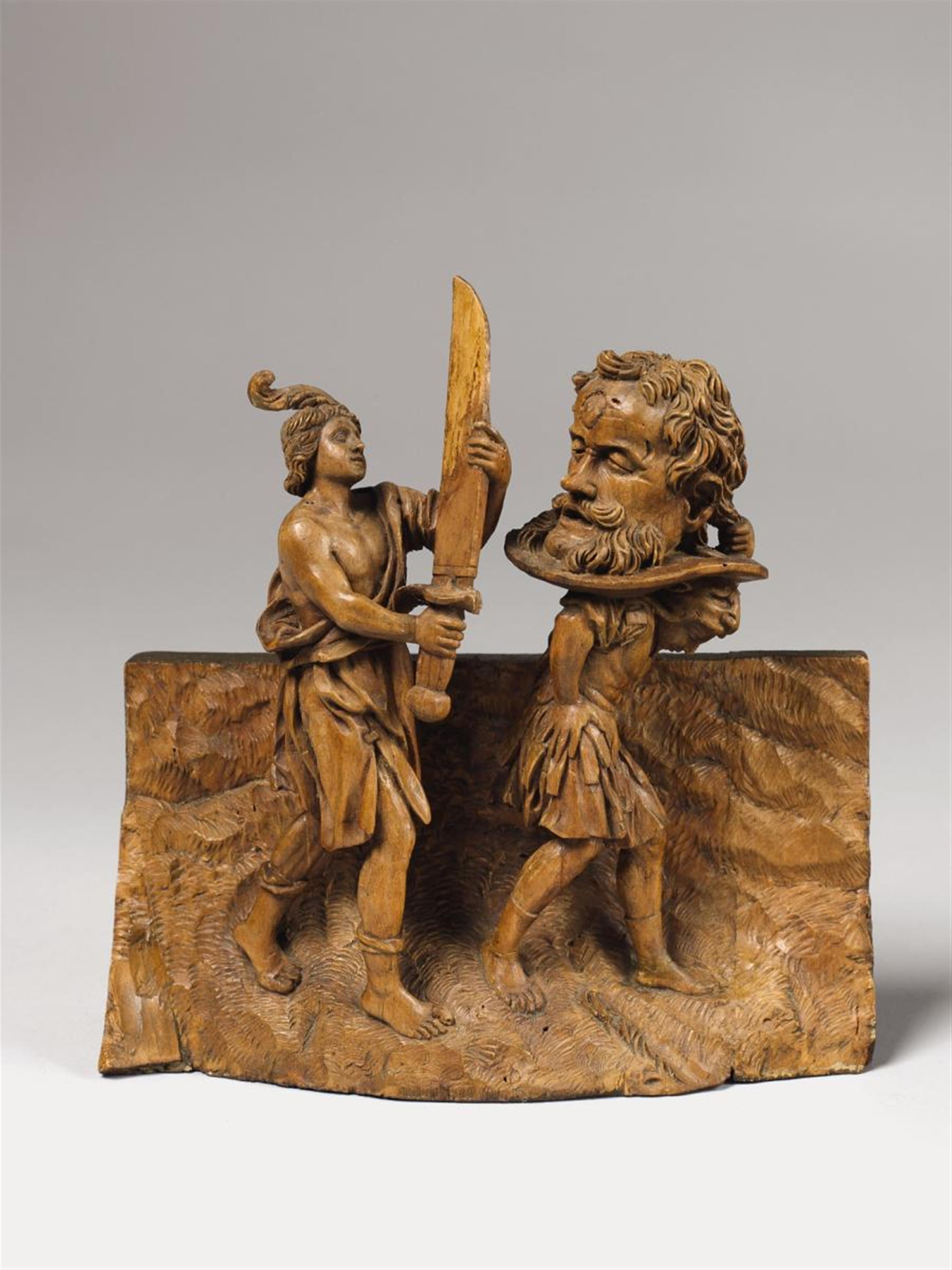 A 17TH CENTURY FLEMISH FRUITWOOD GROUP OF DAVID WITH THE HEAD OF GOLIATH - image-1