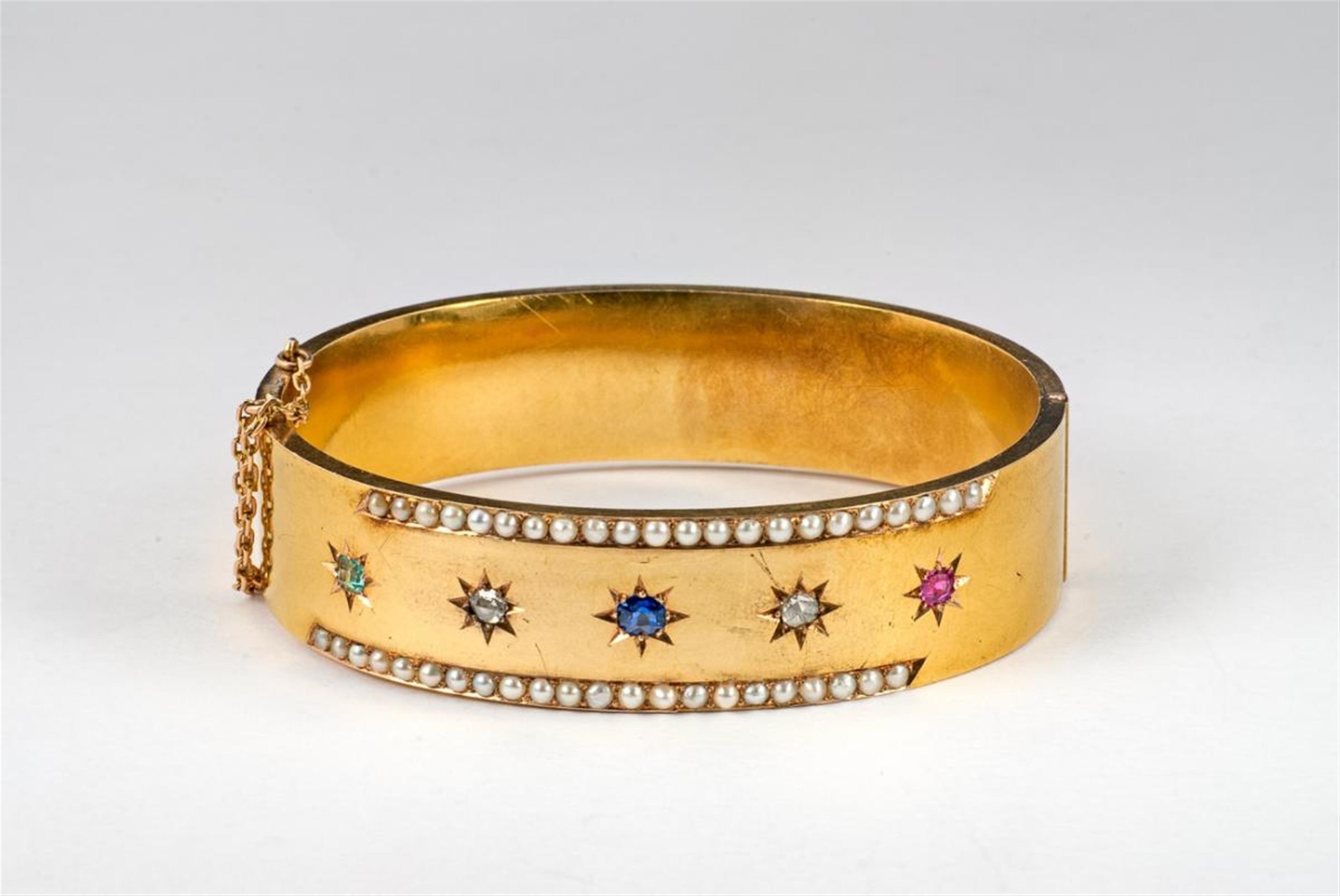 A Belle Epoque 14 ct gold, pearl and gem-set bangle. - image-1