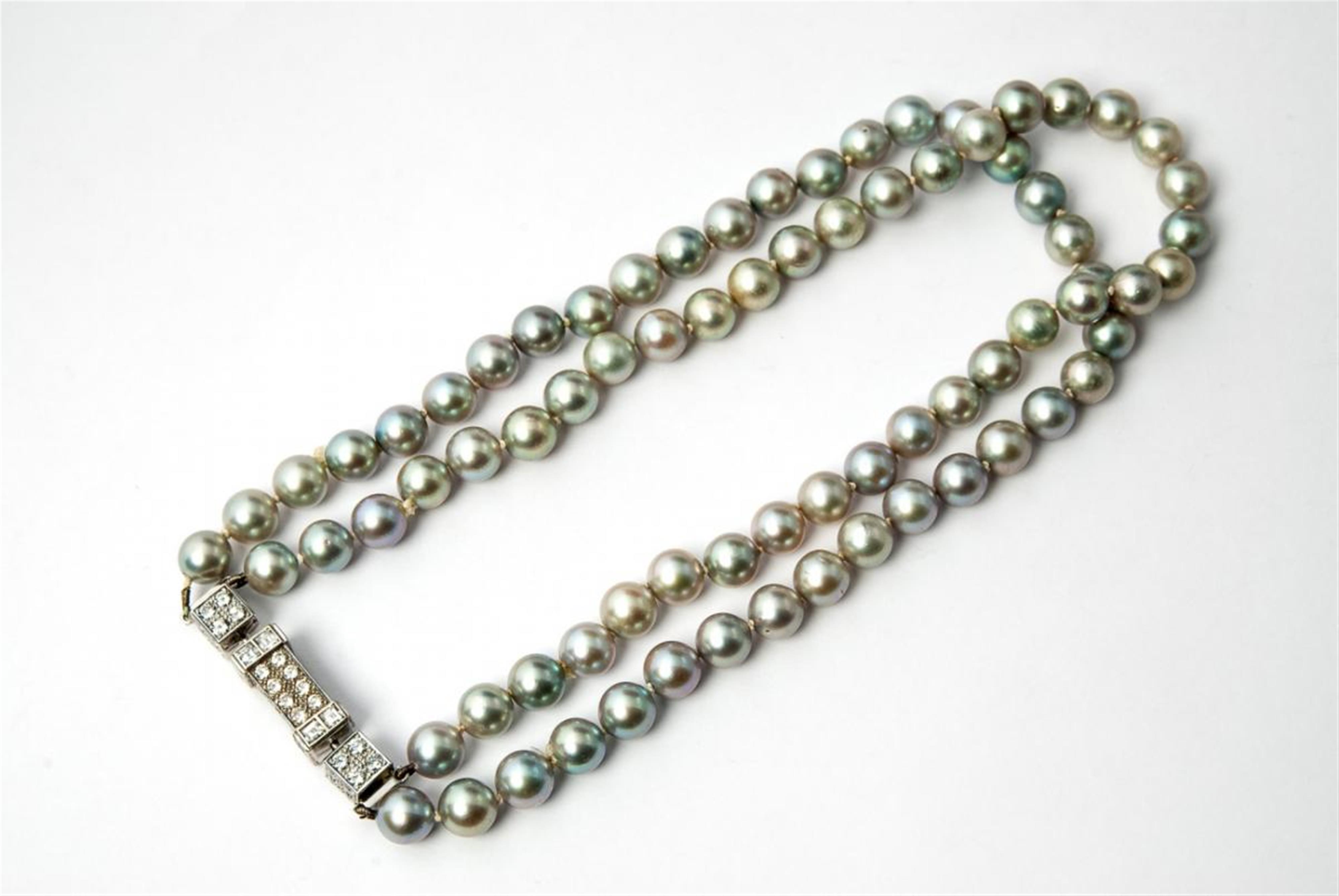 A custom made four-stranded 18 ct white gold and pearl necklace with a brilliant set clasp. - image-1
