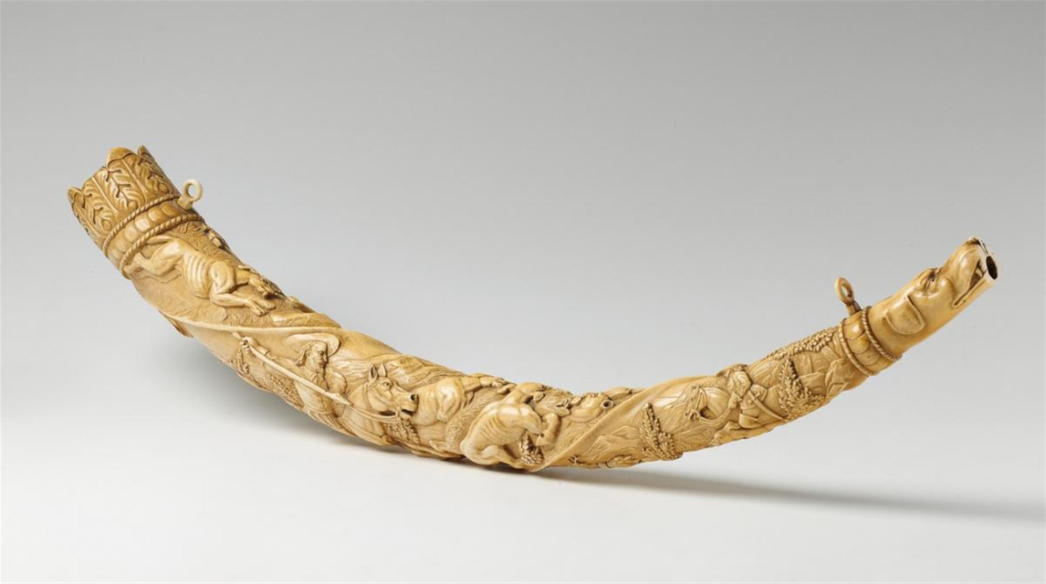 A German carved ivory horn with hunting scenes - image-1