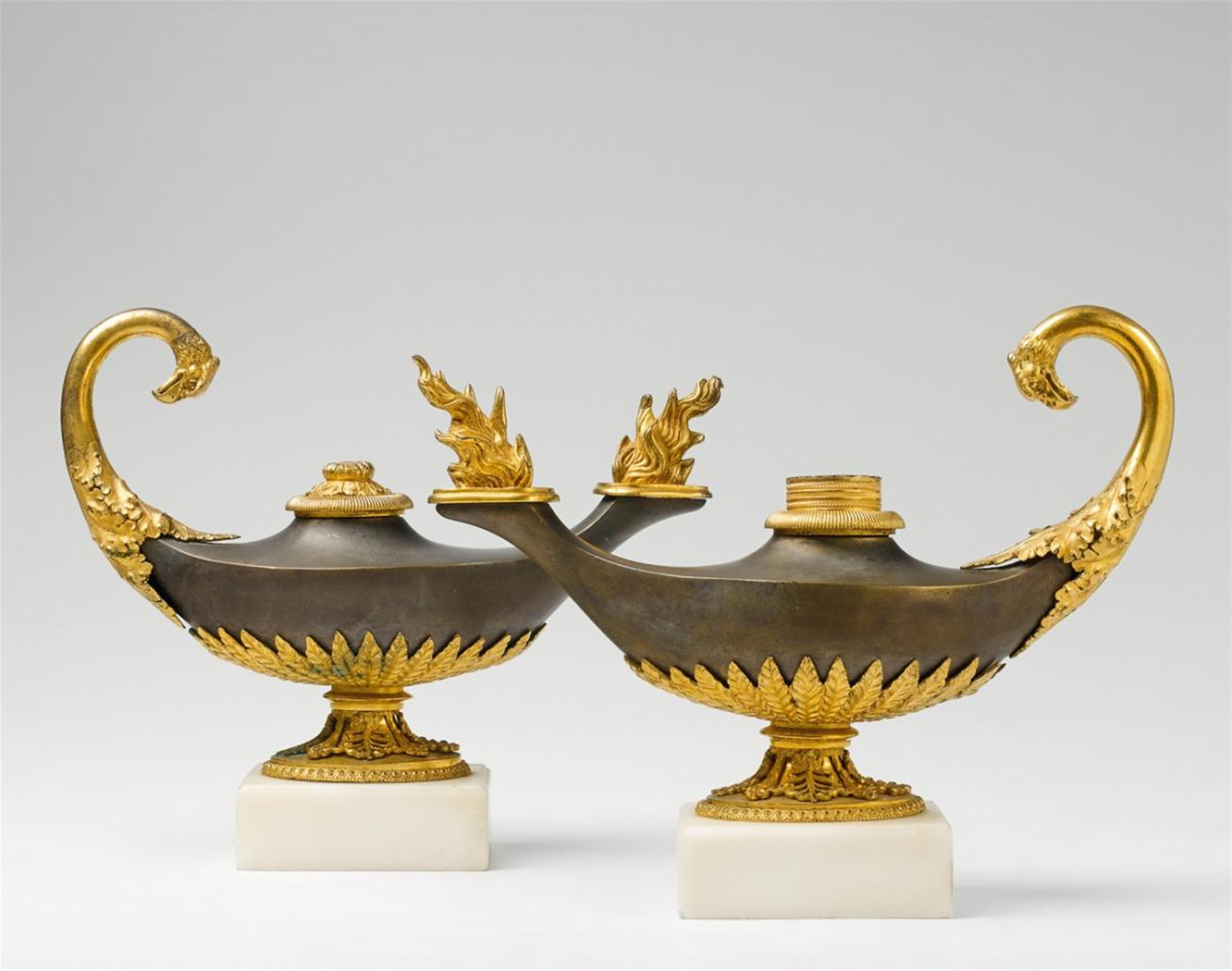A pair of French Etruscan style gilt bronze and marble oil lamps - image-1