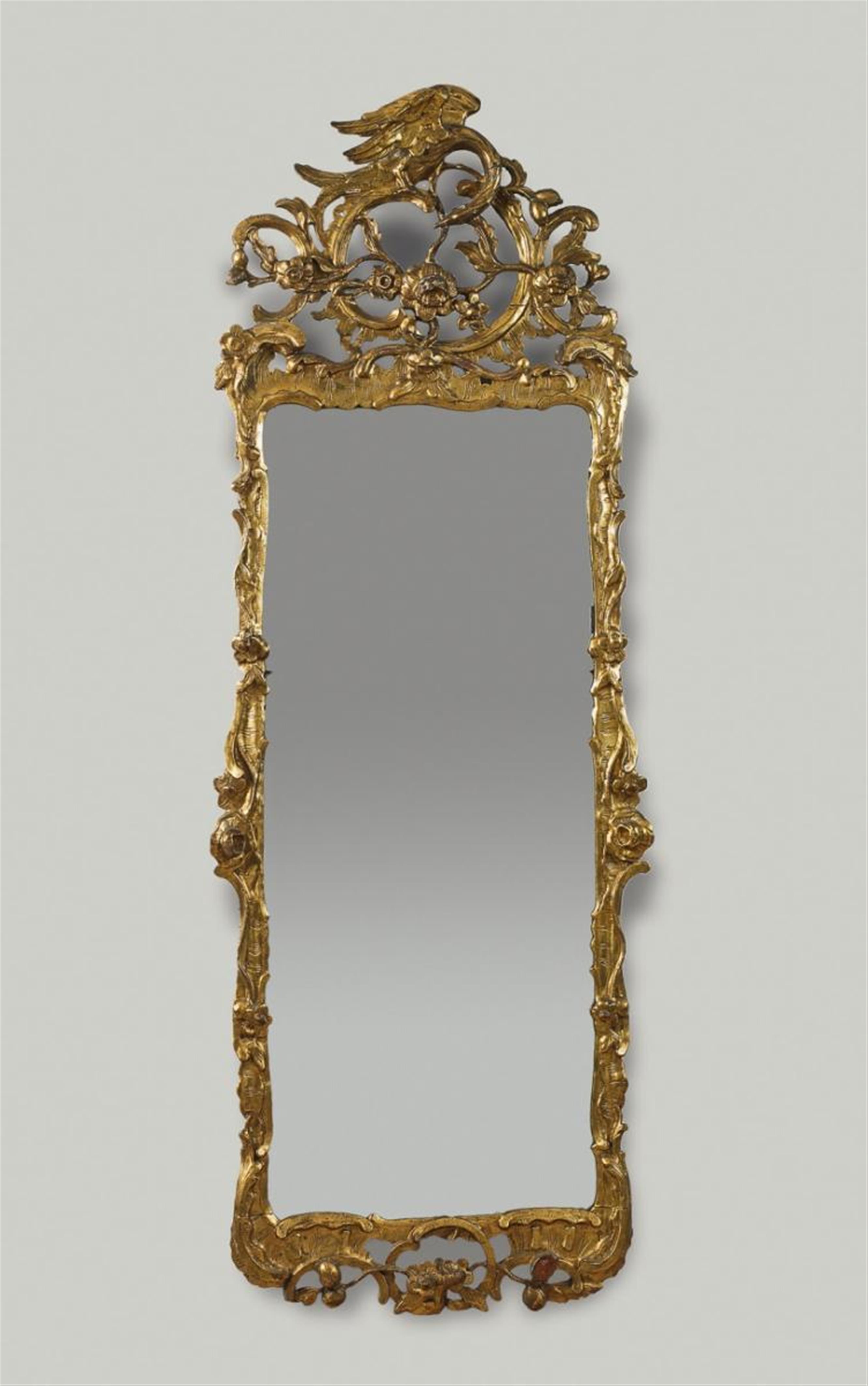 A German Louis XV period entrefenêtre gilt softwood mirror. - image-1