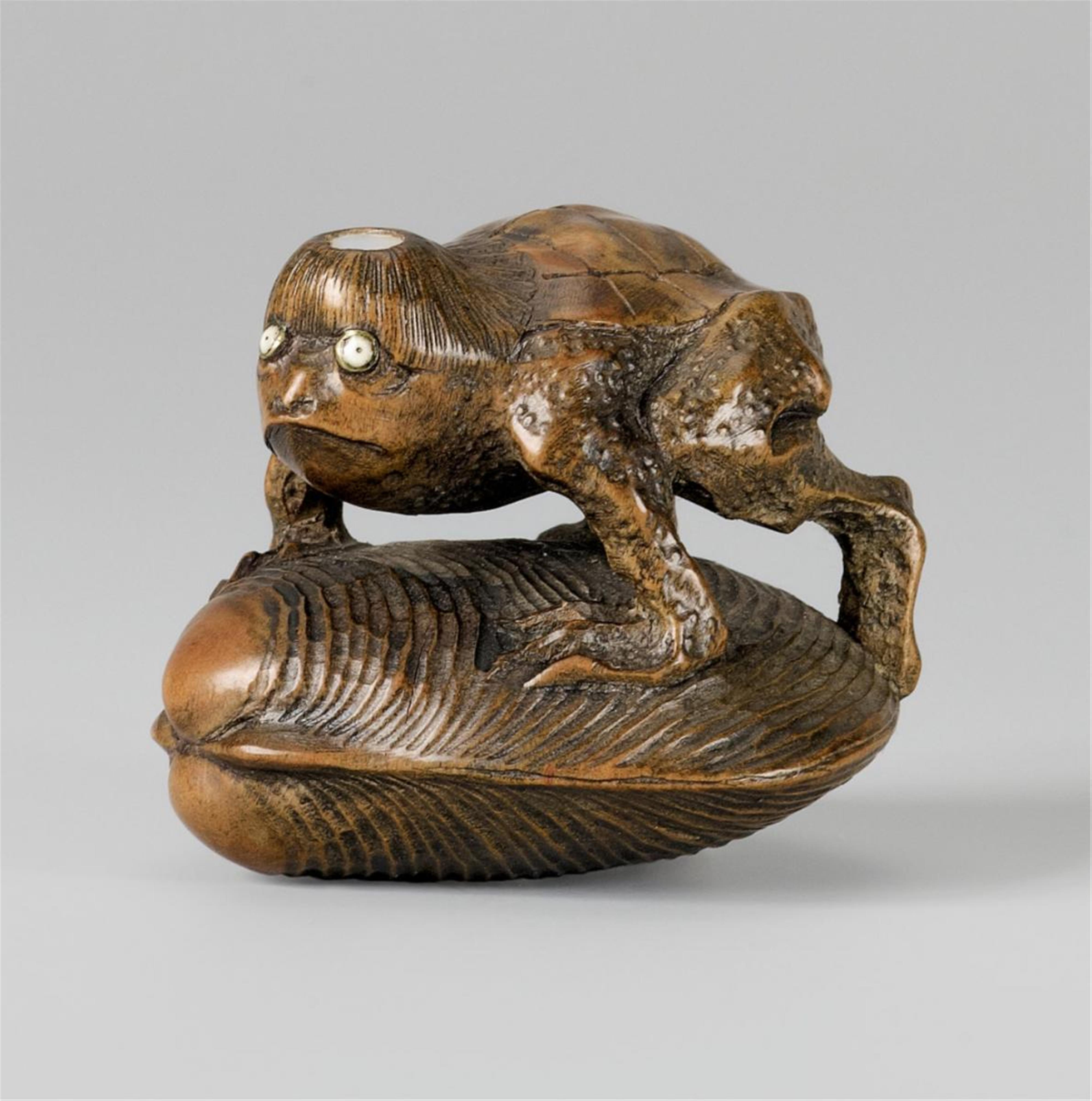 An Edo school boxwood netsuke of a kappa on a hamaguri, by Gyokumin. 19th century - image-1