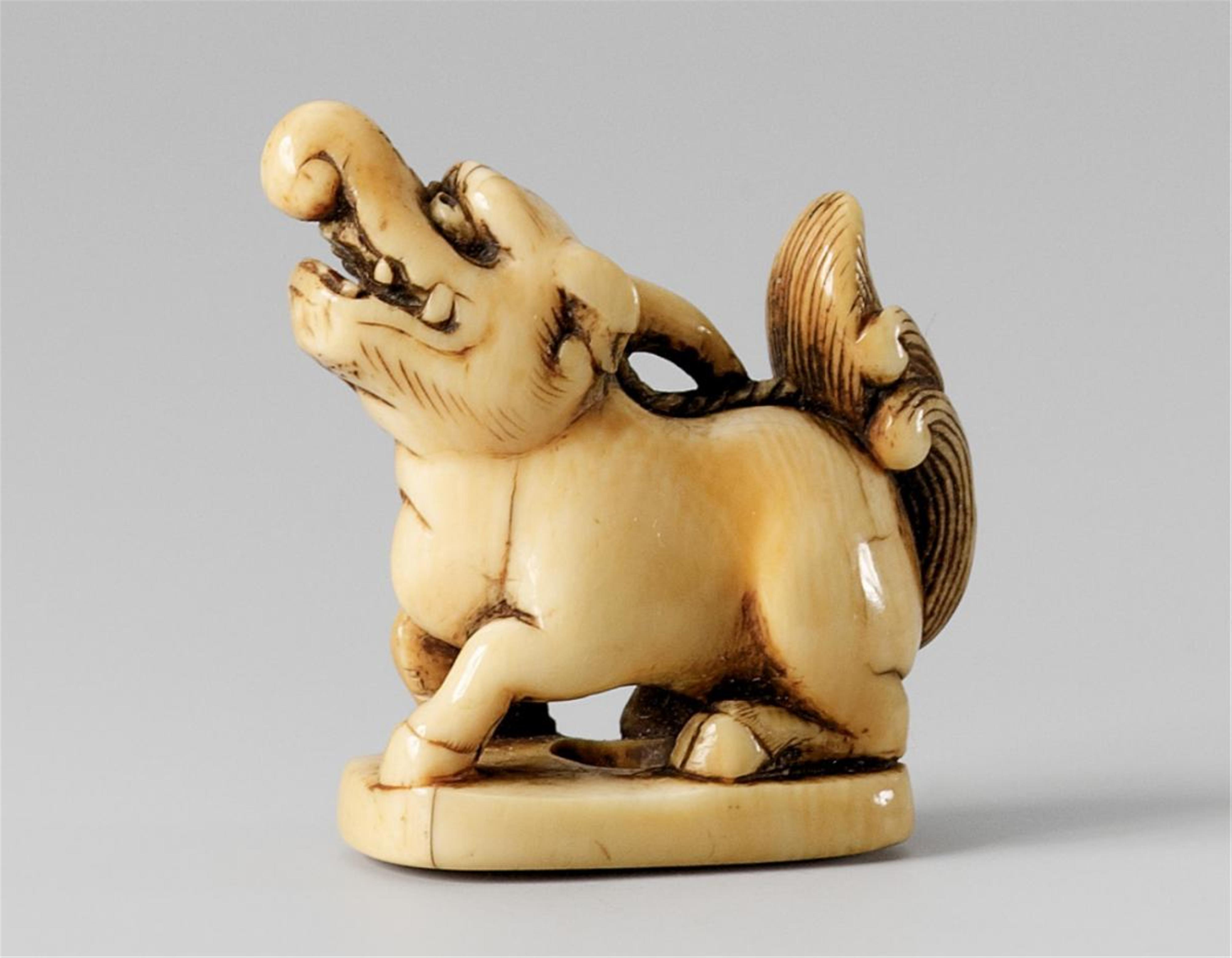 A small ivory netsuke of a one-horned baku. 18th/early 19th century - image-1