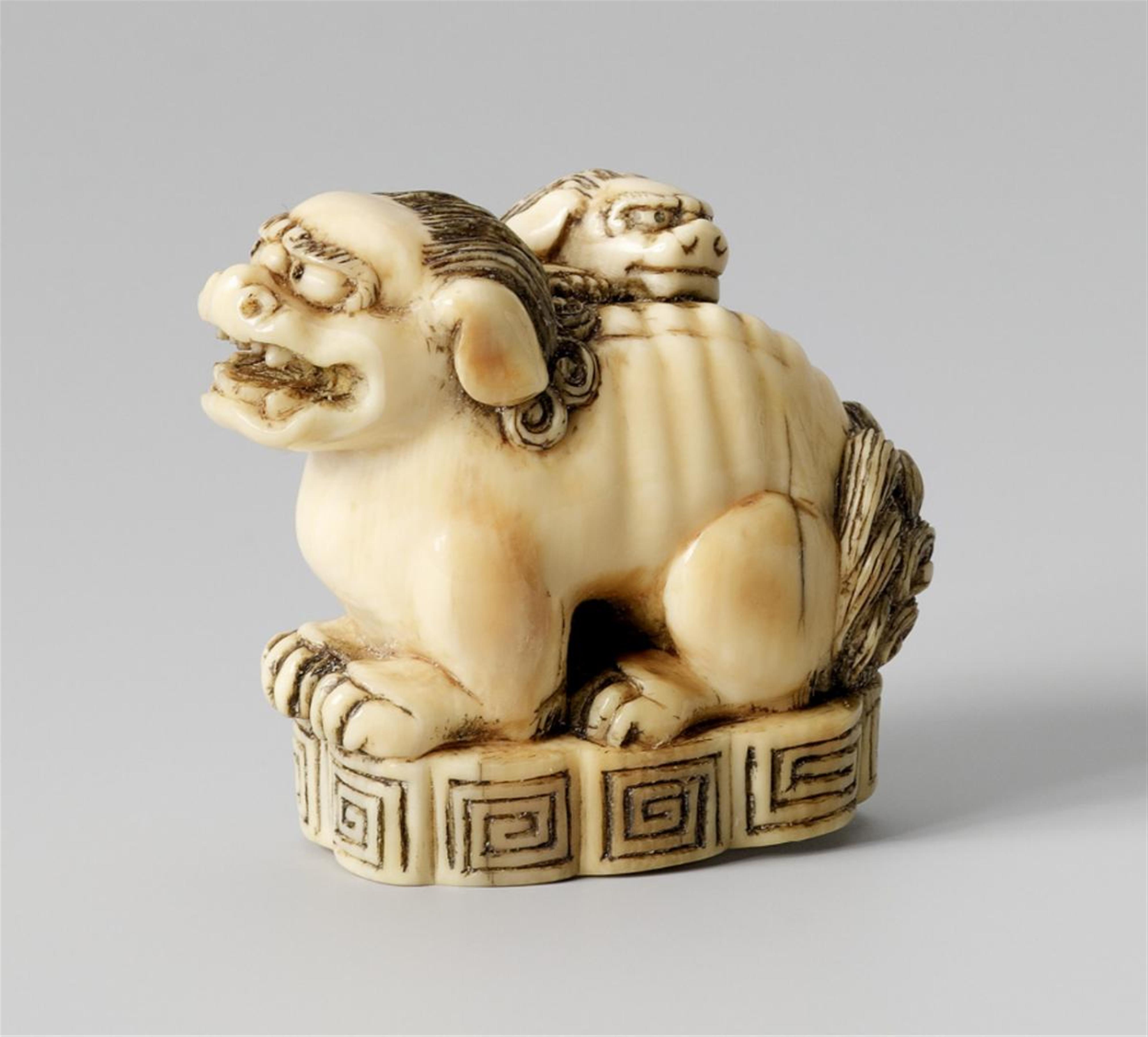 A large ivory netsuke of a shishi and cub. 19th century - image-1