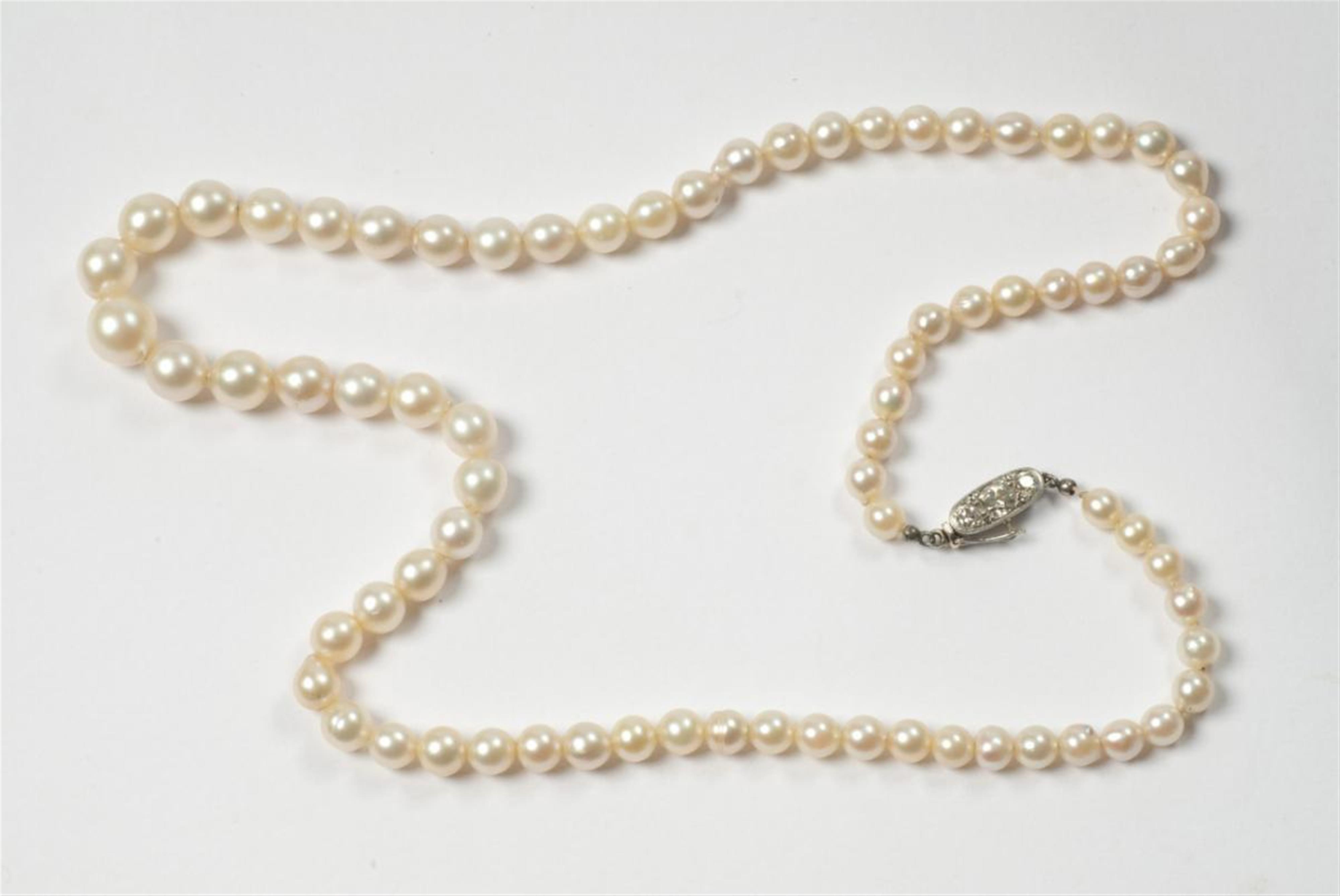 An Art Déco platinum, yellow gold and pearl necklace. - image-1