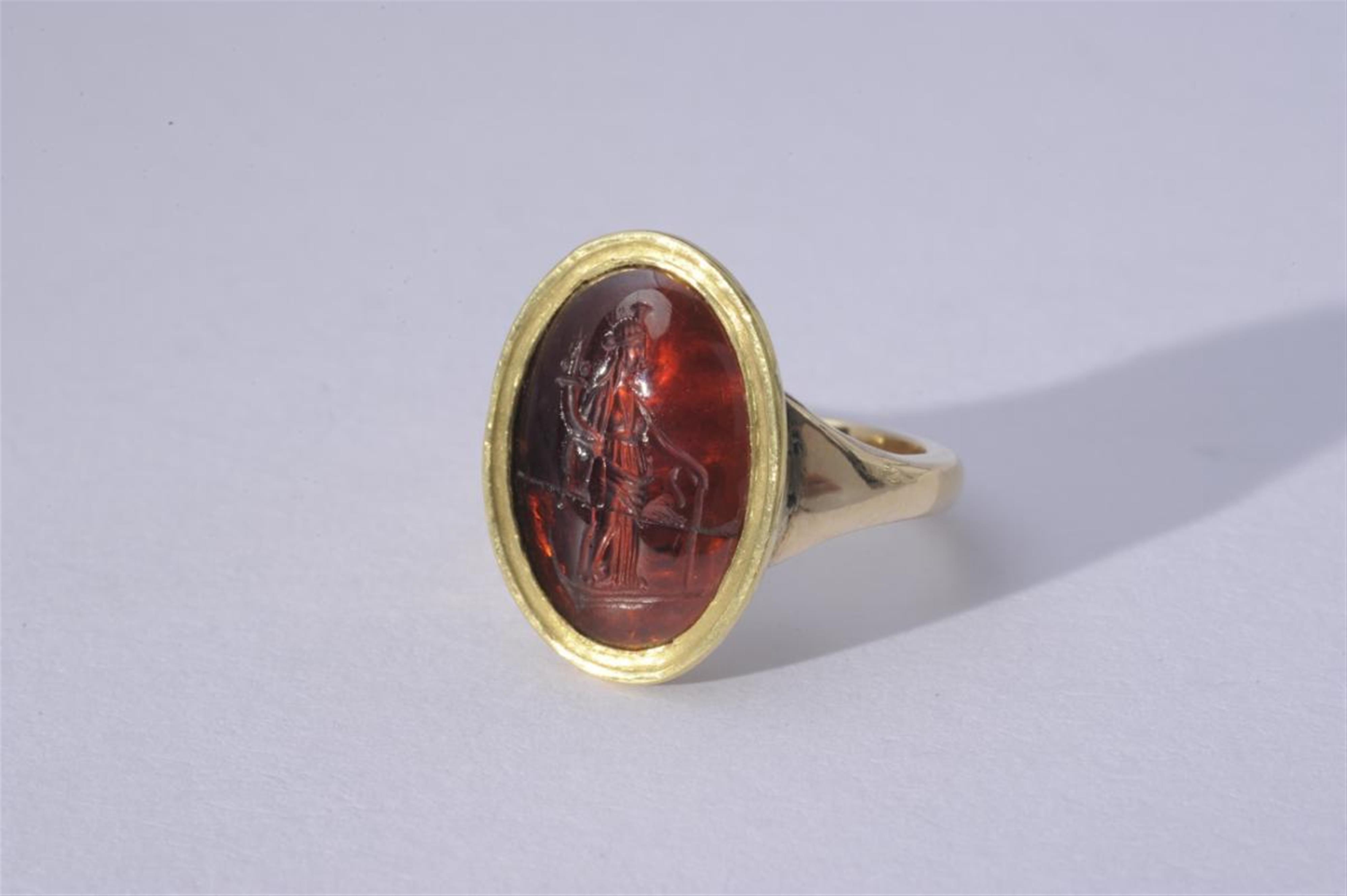 An 18k gold ring set with a Roman intaglio. - image-1