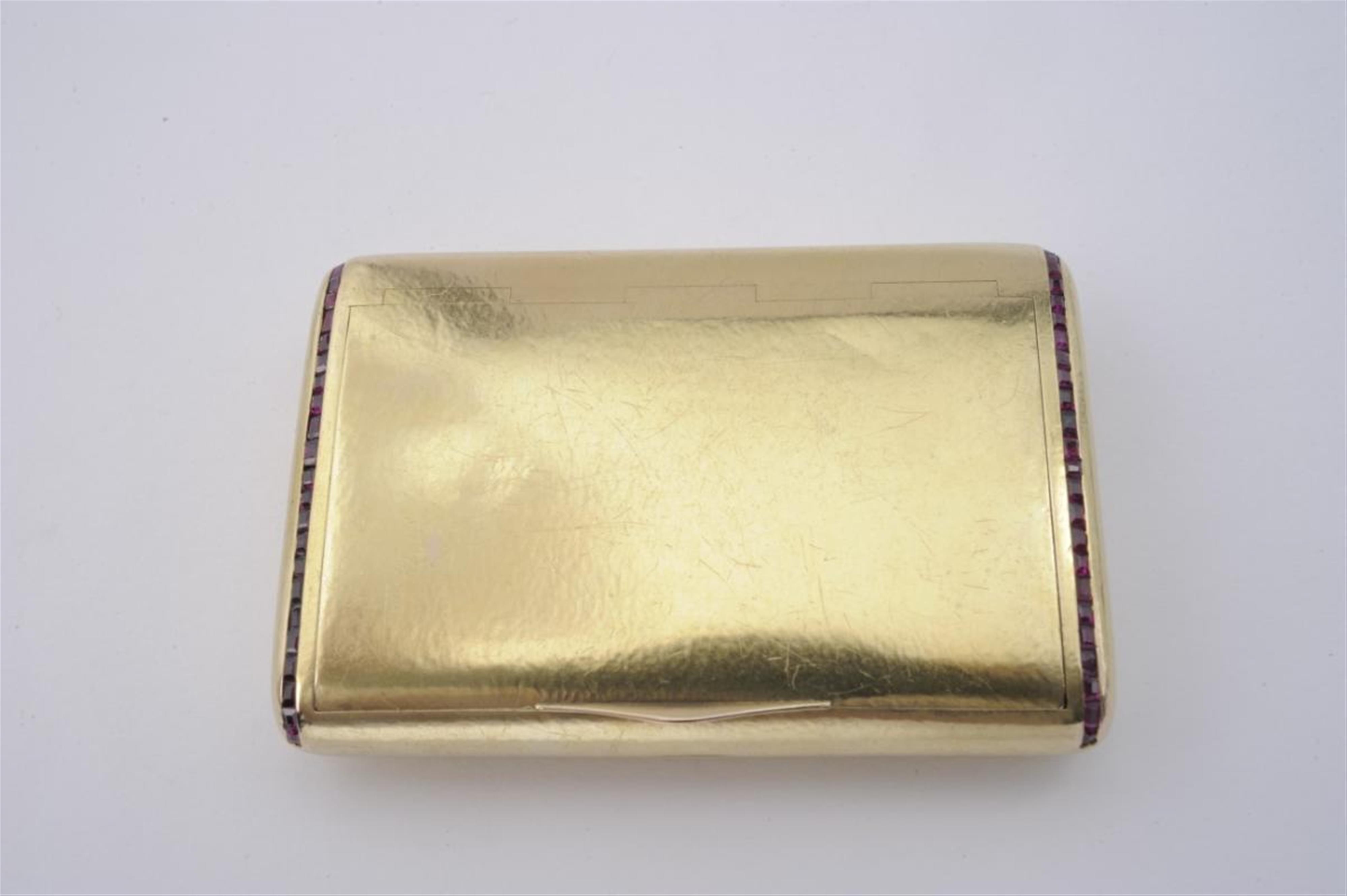 A gold cigarette case. - image-1