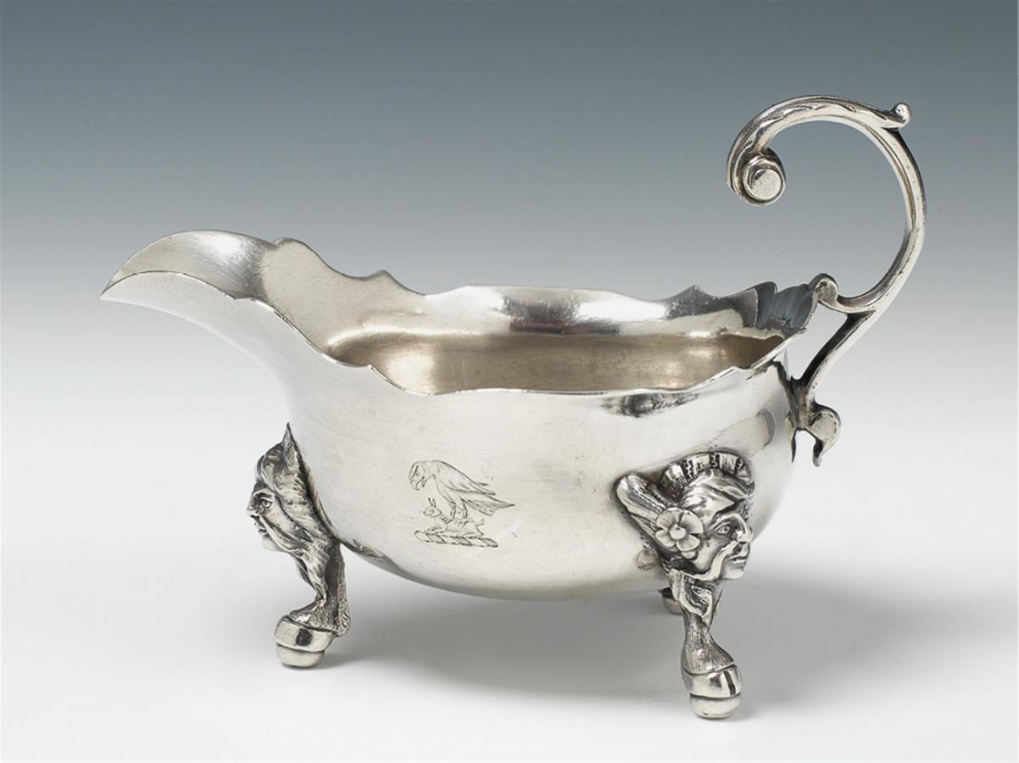 A George III London silver sauce boat. The feet decorated with busts of Ottomans' heads. Marks of Joseph Steward II, ca. 1770. - image-1