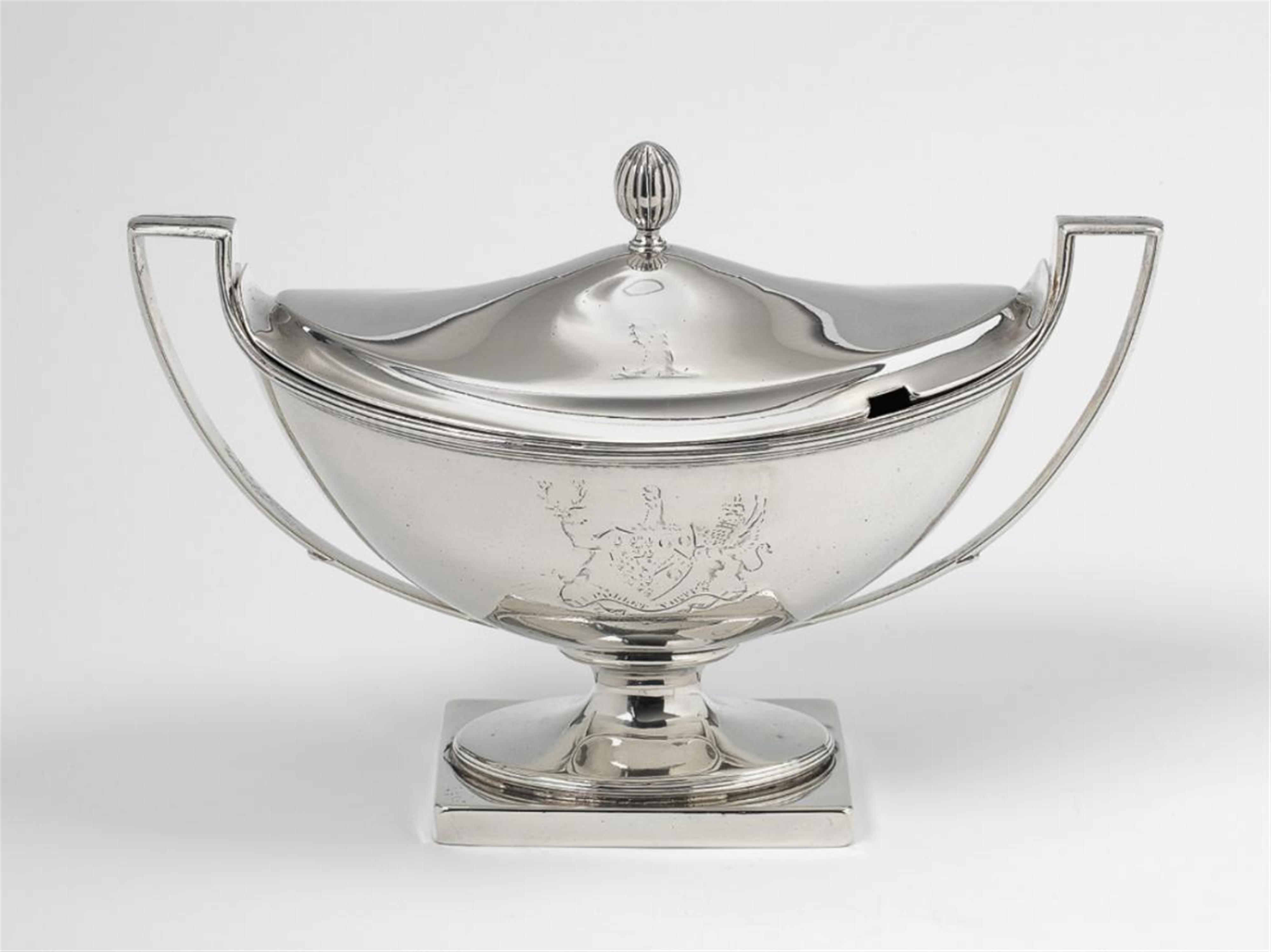 A George III London silver sauceboat and cover. Engraved with a coat-of-arms and motto to the body, the lid with a crest. Marks of Peter Podio, 1792. The engravings worn. - image-2