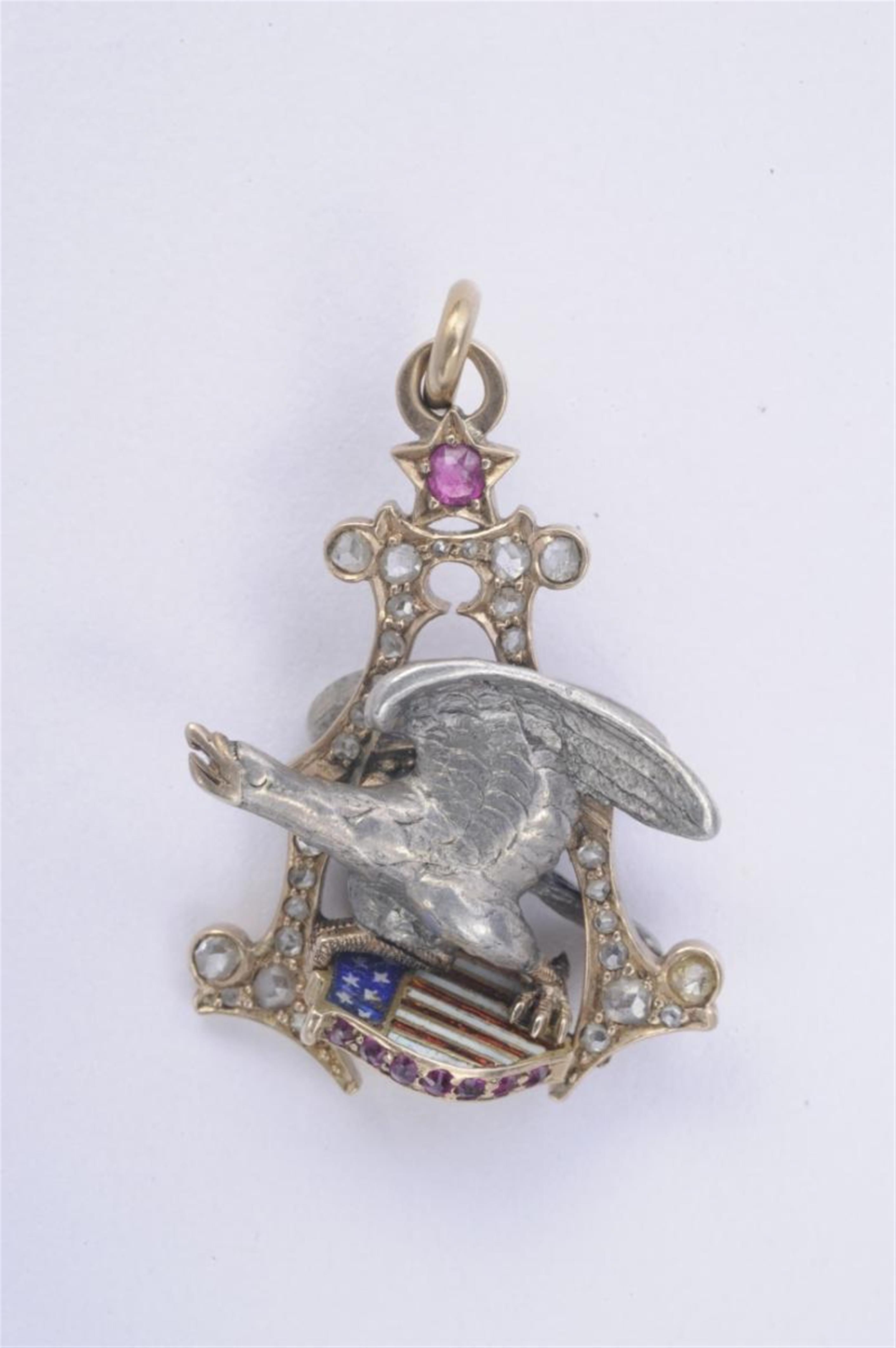 A 14k rose gold and silver pendant with USAmerican coat of arms. - image-1
