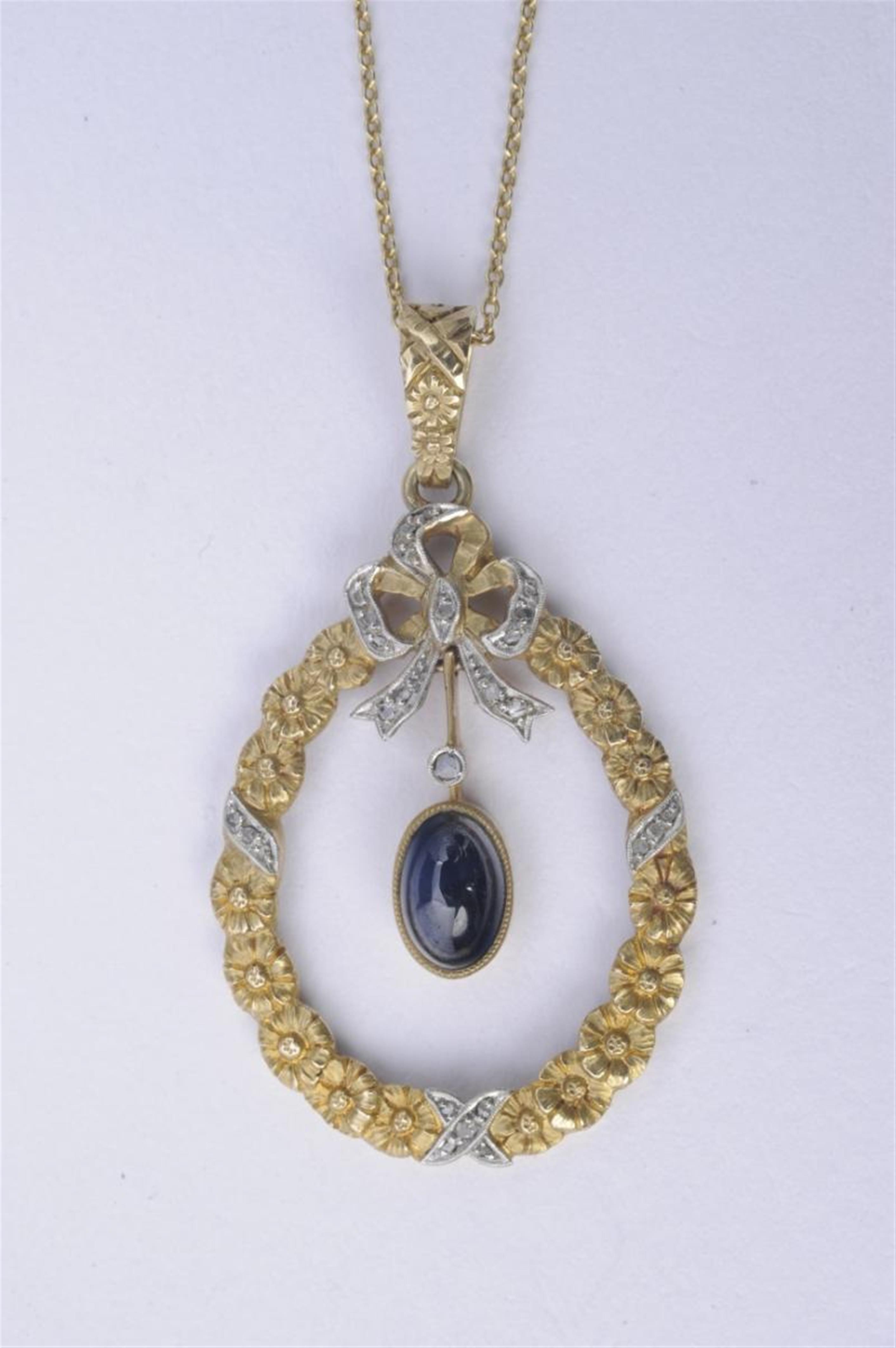 A 14k gold, diamond and sapphire Belle Epoque pendant formed as a wreath. - image-1