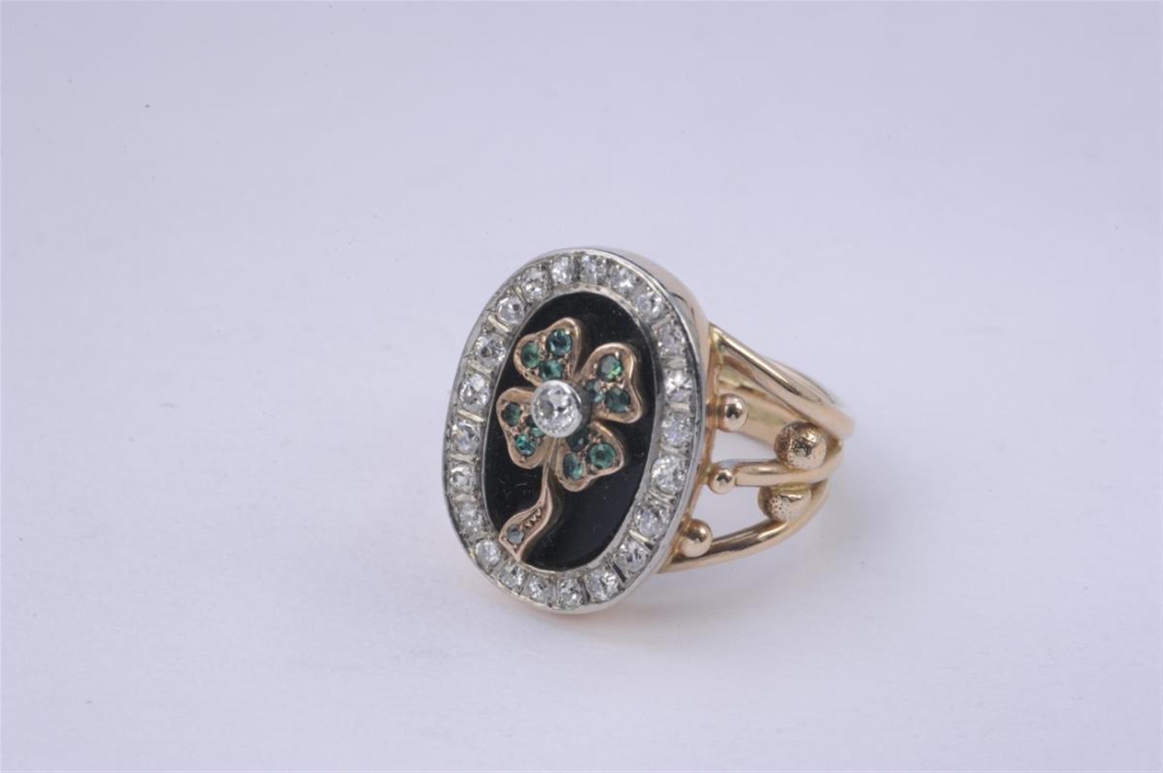 A 14k red gold, onyx and emerald lover's ring formed as a clover leaf. - image-1