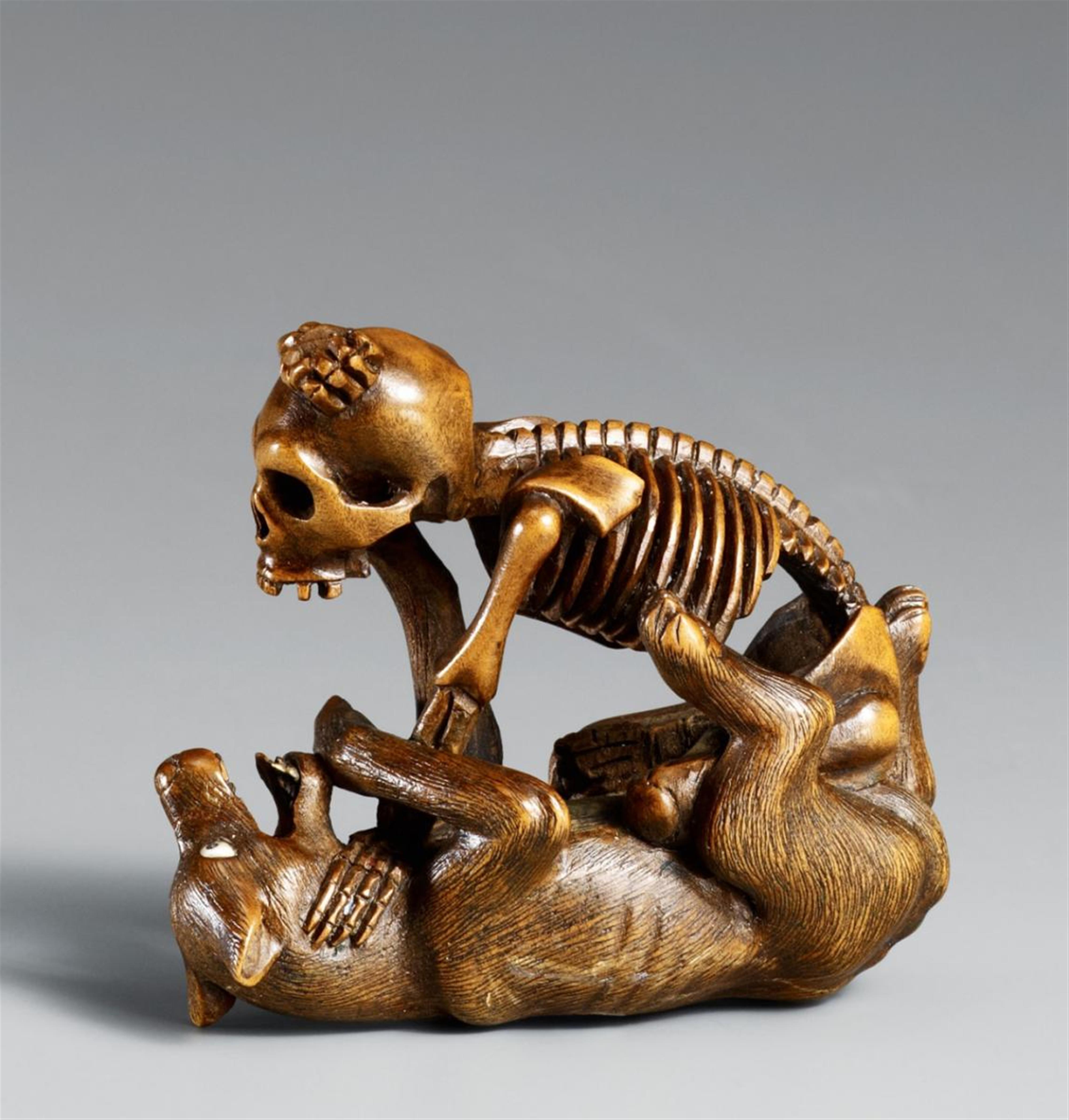 A boxwood netsuke of a skeleton and a wolf in the style of Shôko. Late 19th century - image-1