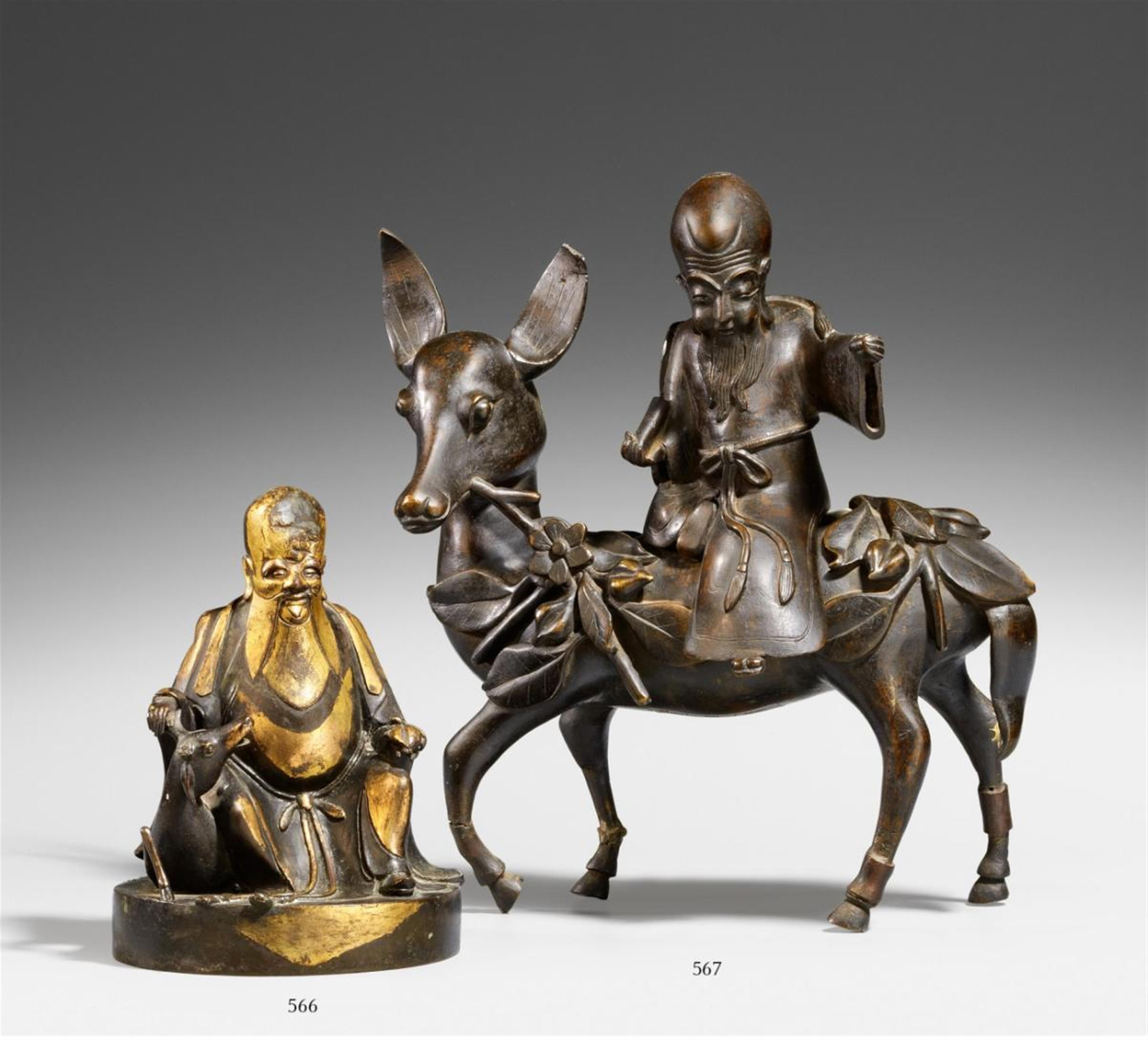 A bronze figure of Shoulao seated on a deer. Ming/Qing dynasty - image-1