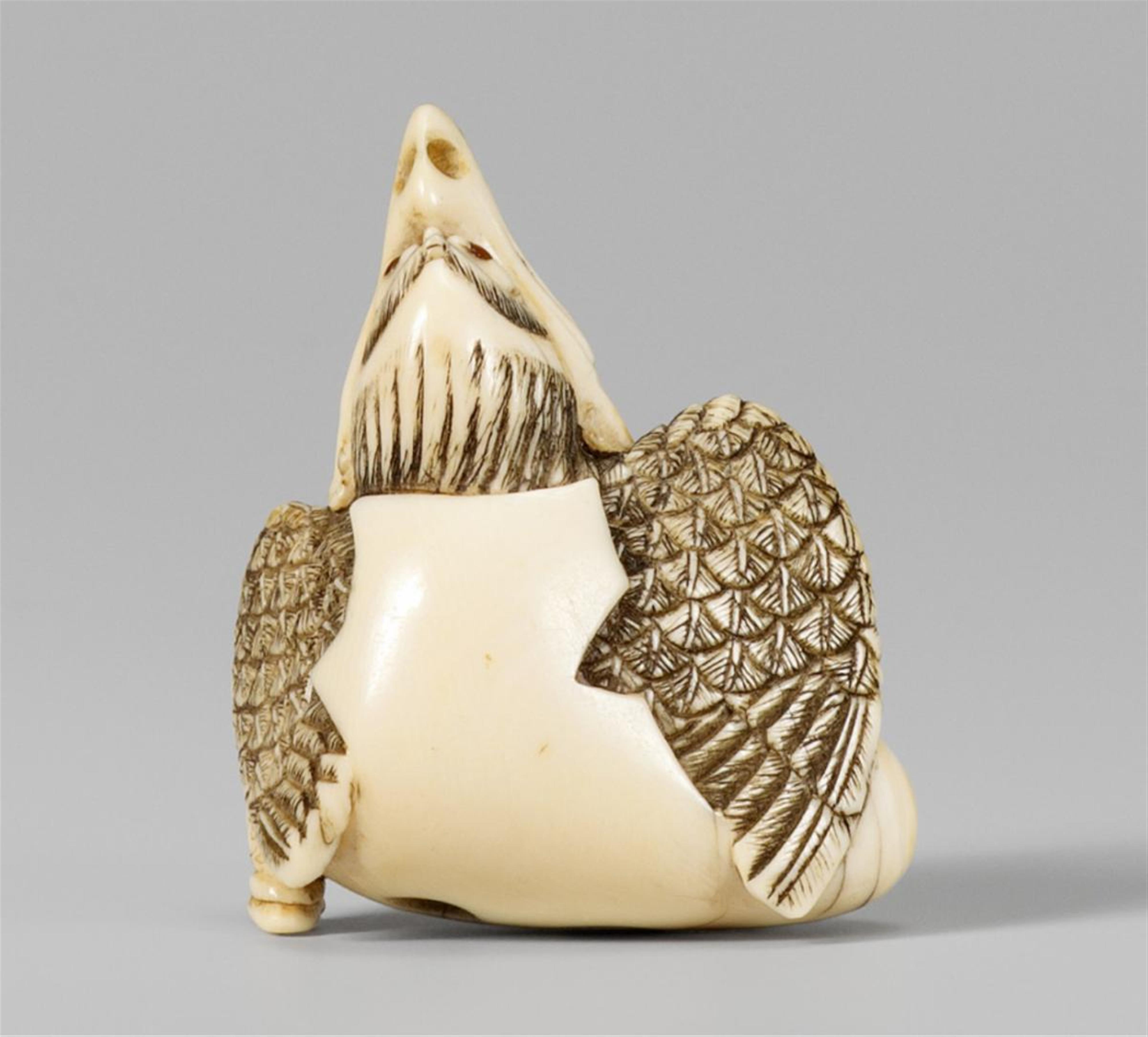 An ivory netsuke of a karasu tengu hatching from an egg. Early 19th century - image-1