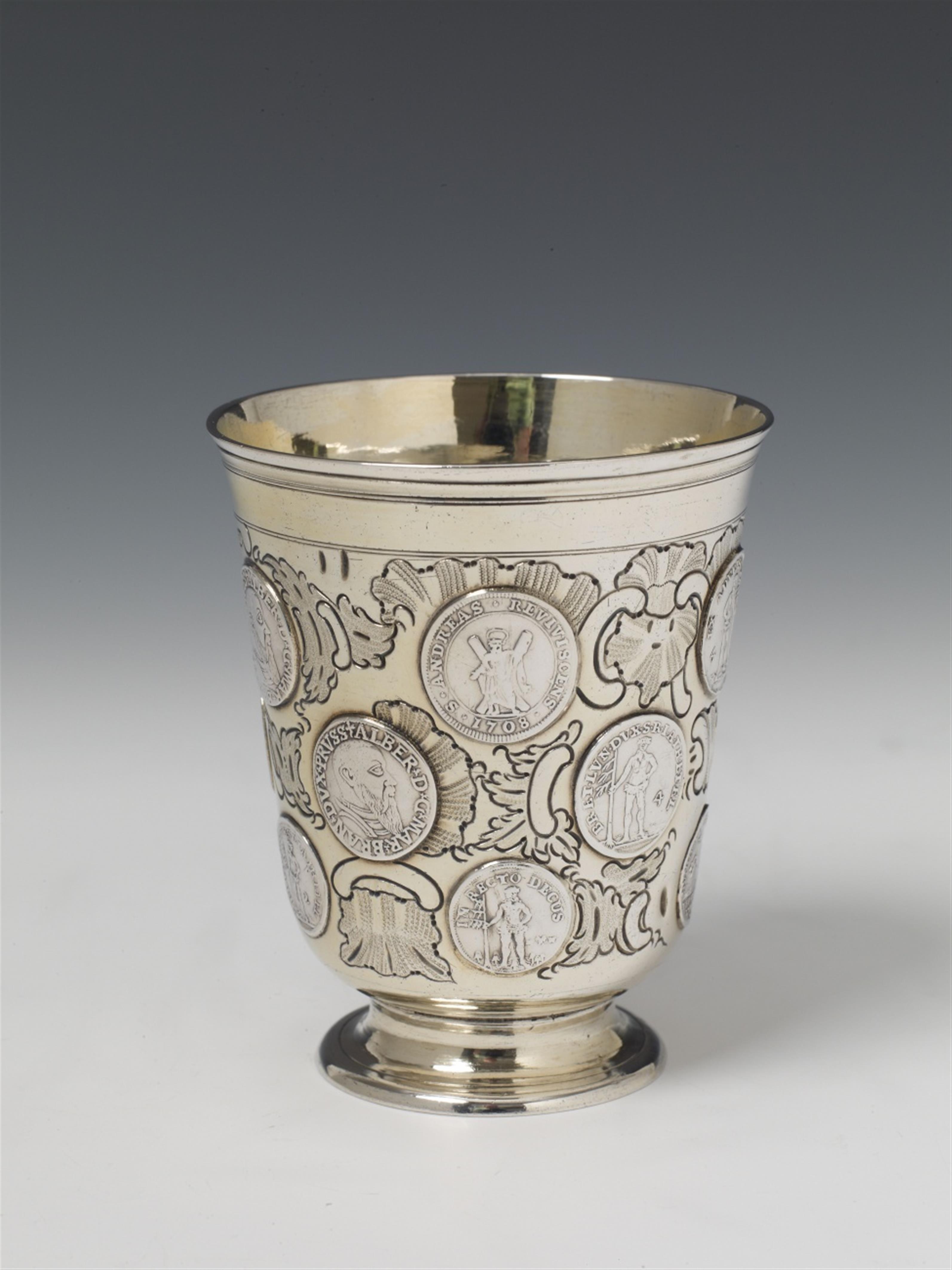 A Berlin silver partially gilt coin-set beaker. With 15 Brunswick-Lüneburg and Brandenburg coins dated from 1686 to 1750. Marks of Gebrüder Müller, ca. 1760. - image-1