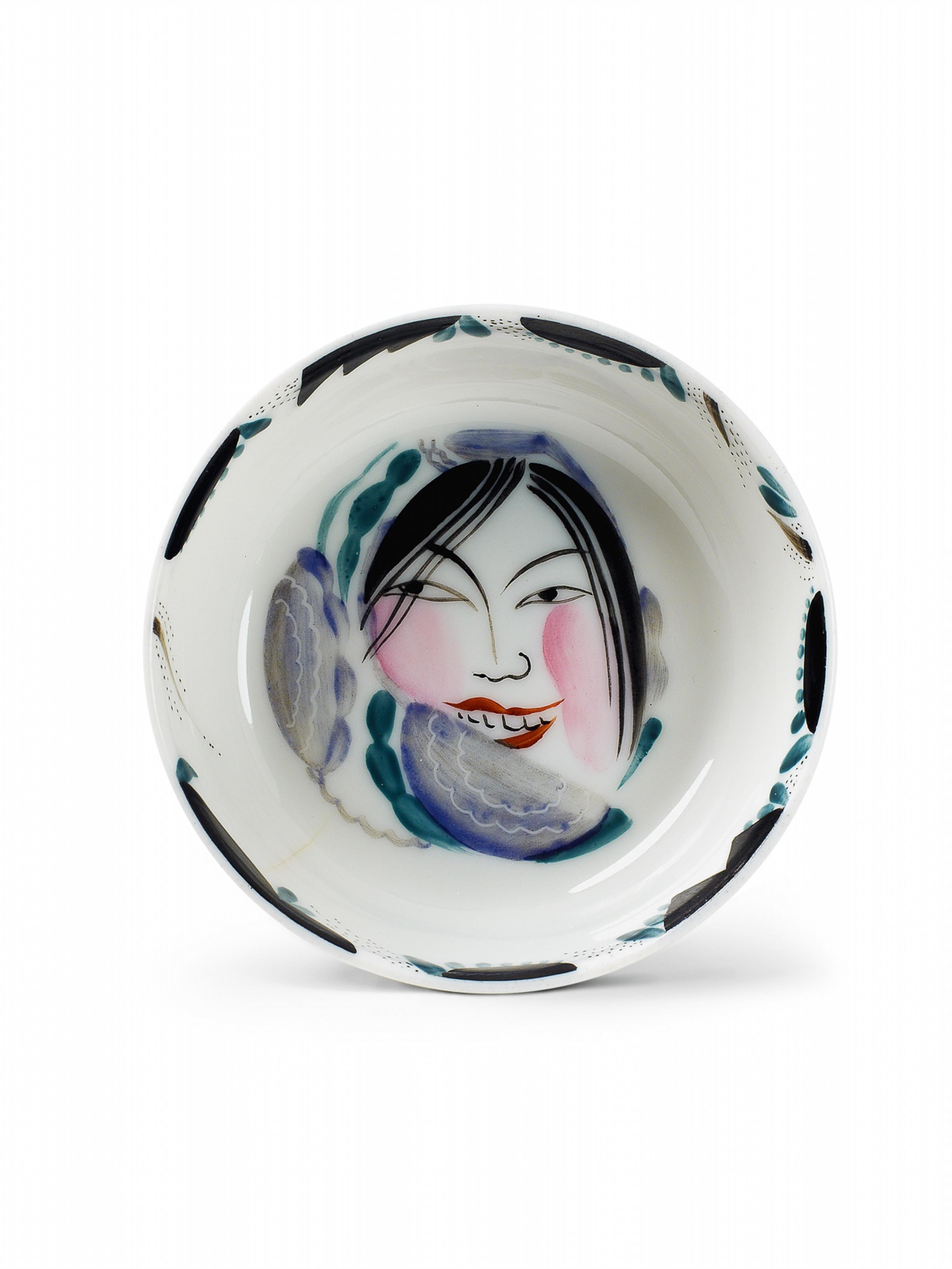 A small porcelain bowl painted with the face of a happy peasant woman. - image-1