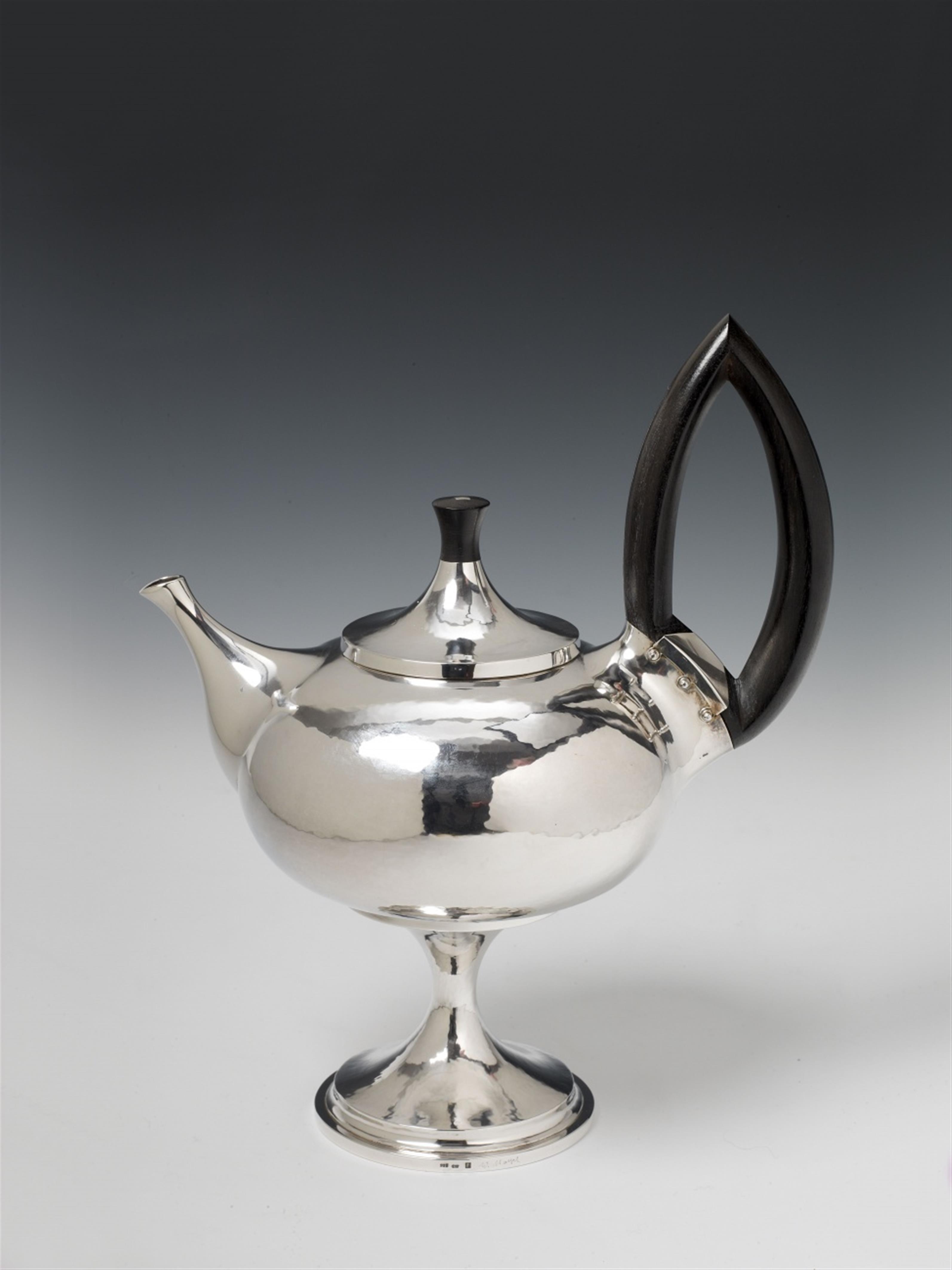 A Cologne silver interior gilt teapot. The handle and finial of ebony. Marks of Wilhelm Nagel, 1976. - image-1