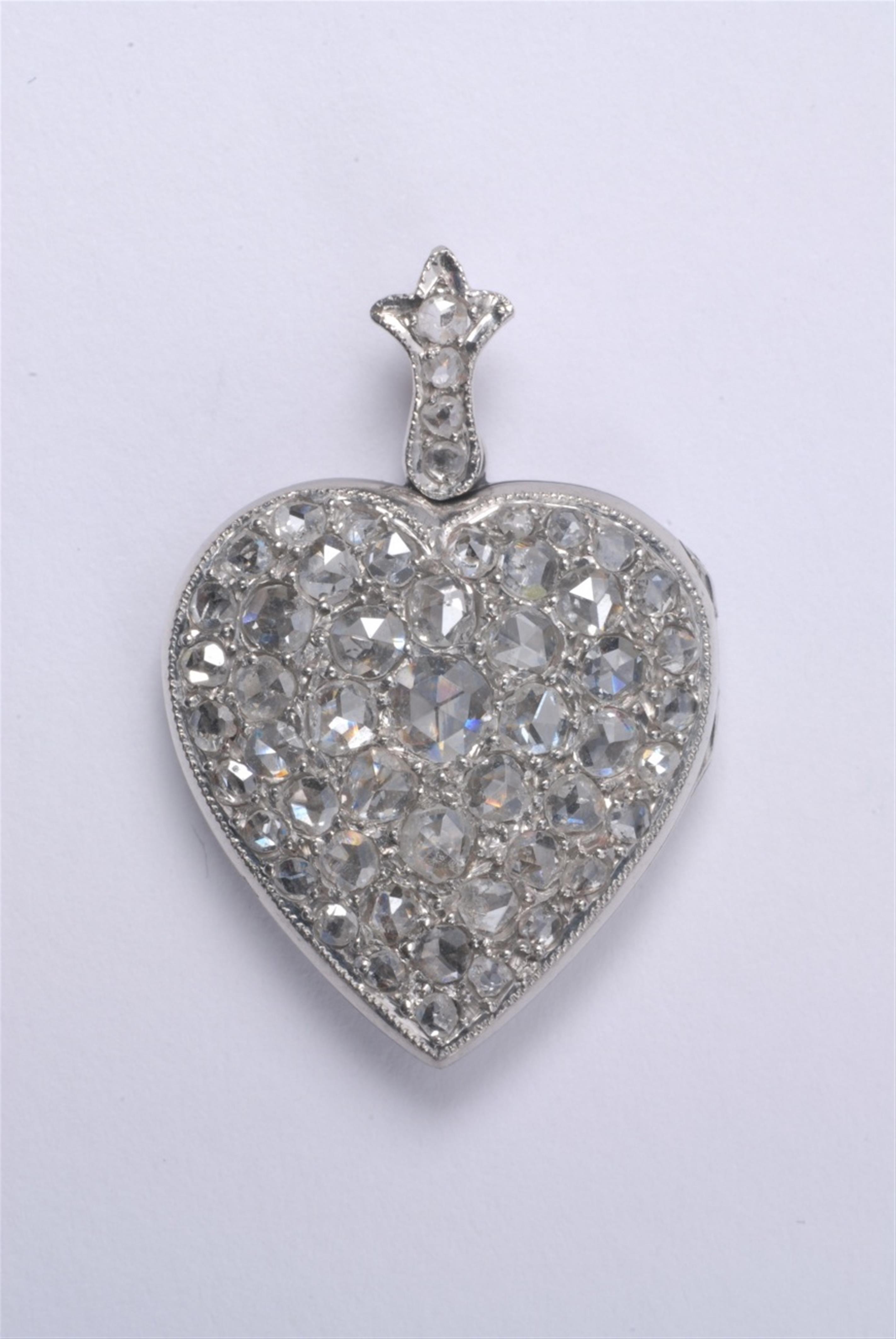 A French heart shaped platinum medallion - image-1