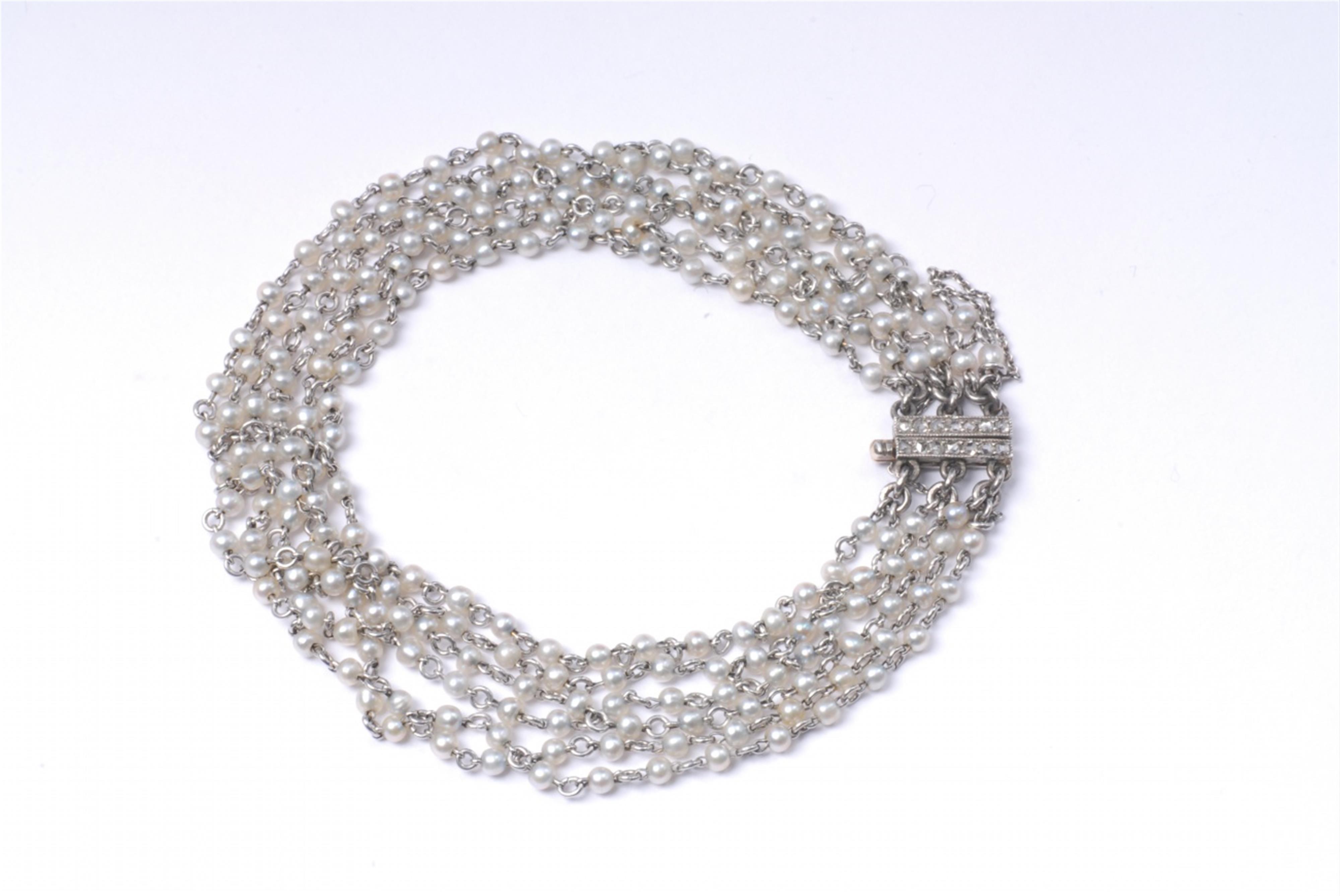 A six stranded platinum and pearl belle epoque bracelet. - image-1