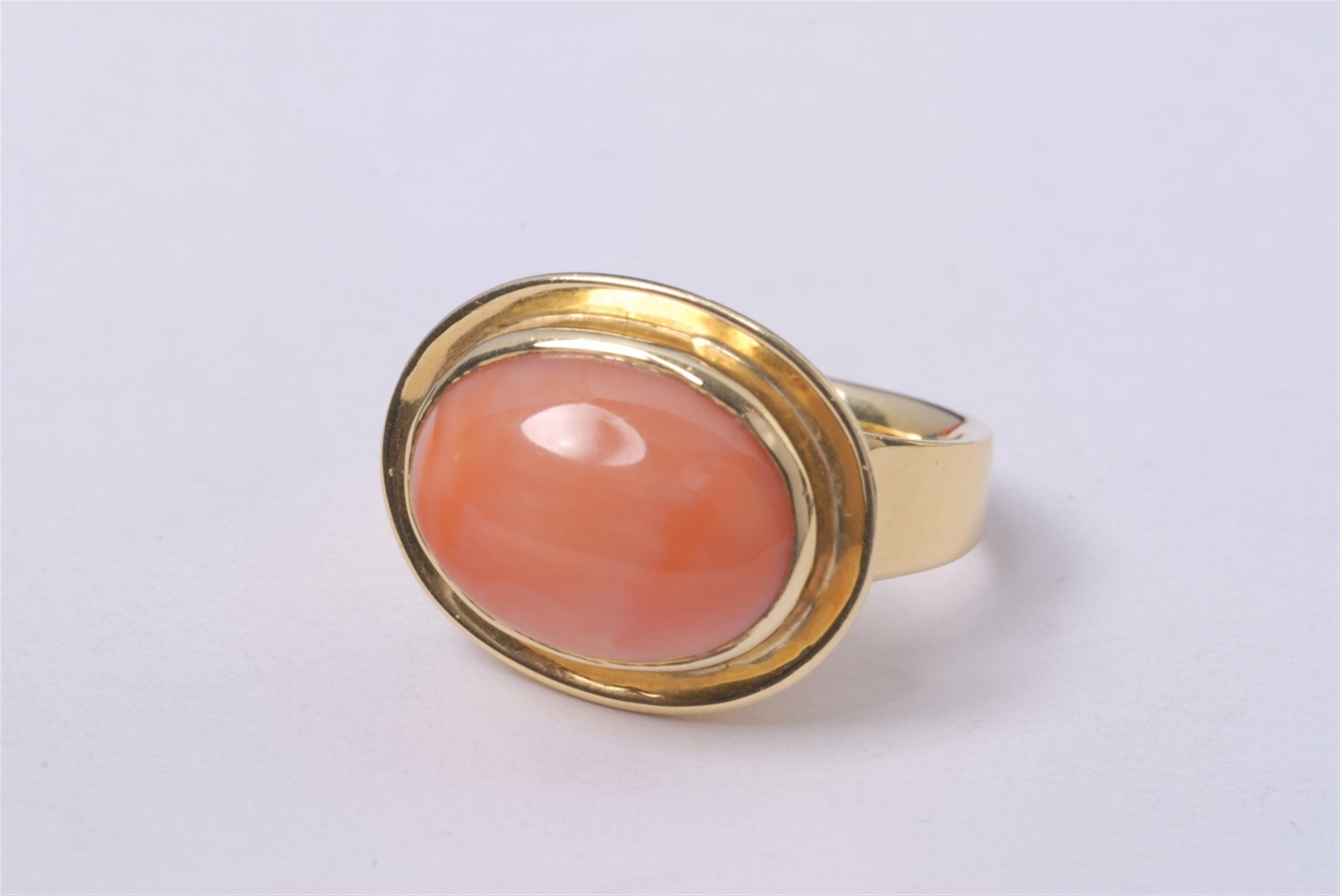 A London 18k gold and natural coral ring. - image-1