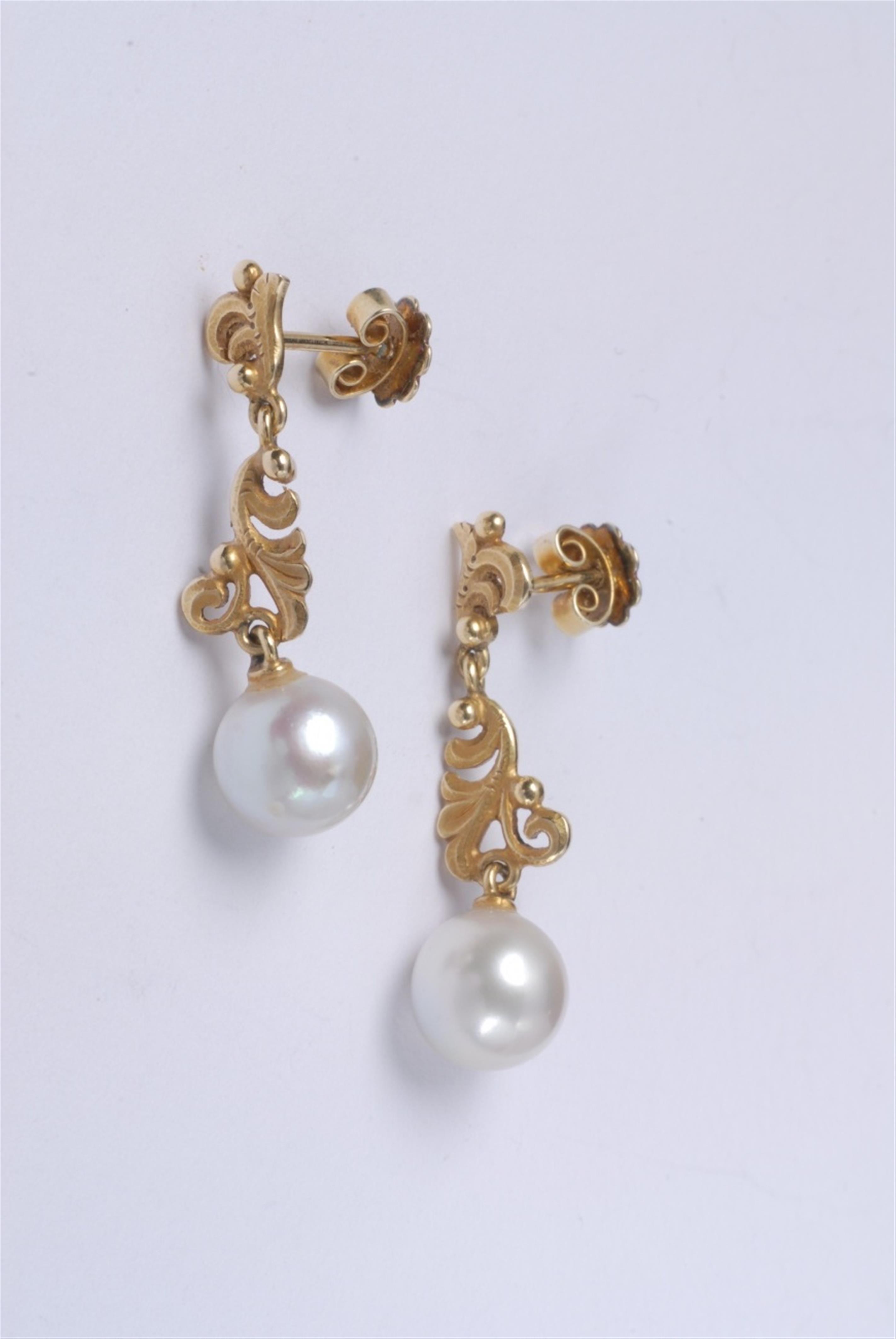 A pair of 18k gold and pearl drop earrings. - image-1