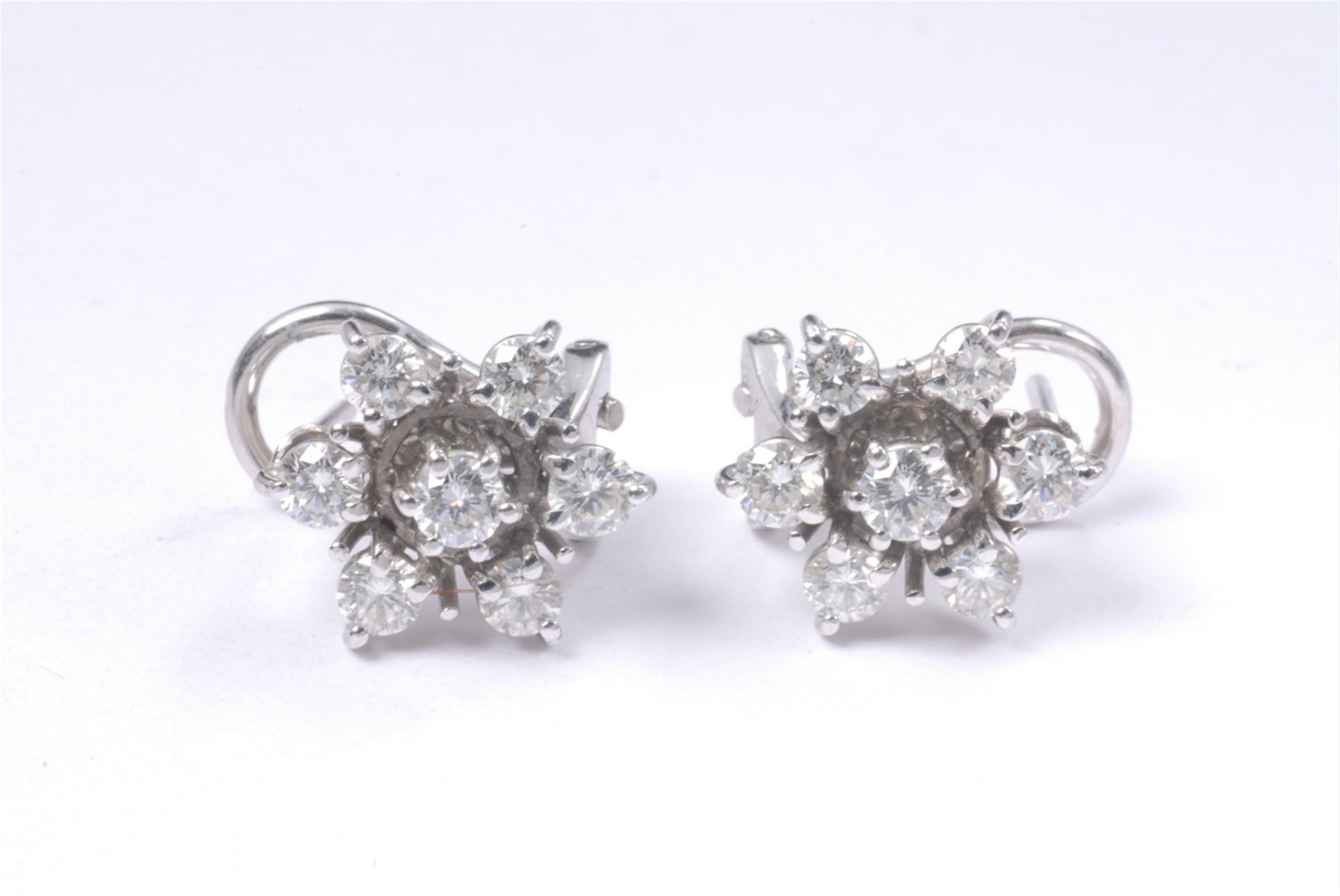 A pair of 18k white gold and diamond clip earrings. - image-1