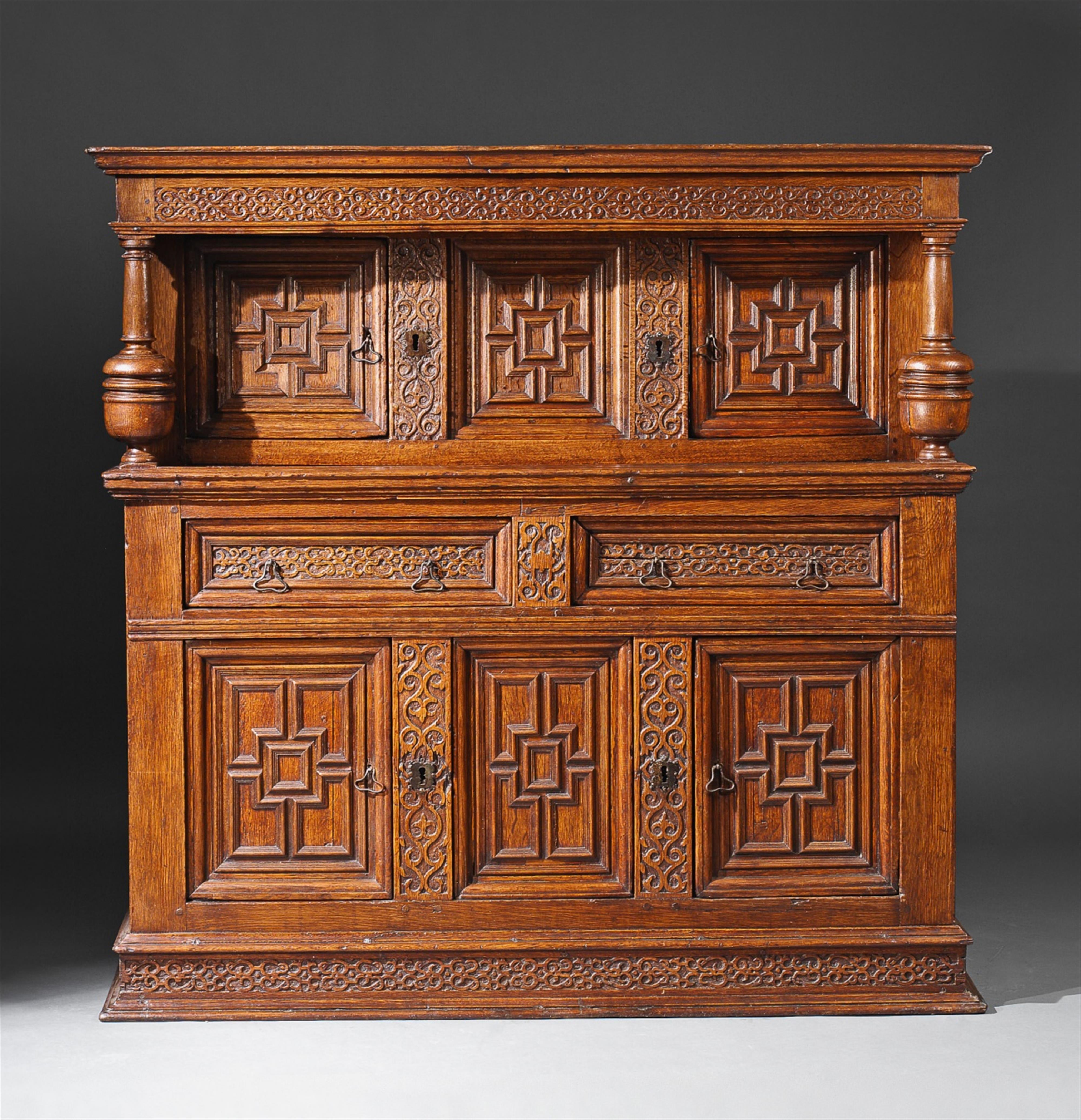 An English Charles I period iron mounted carved oak cupboard. - image-1