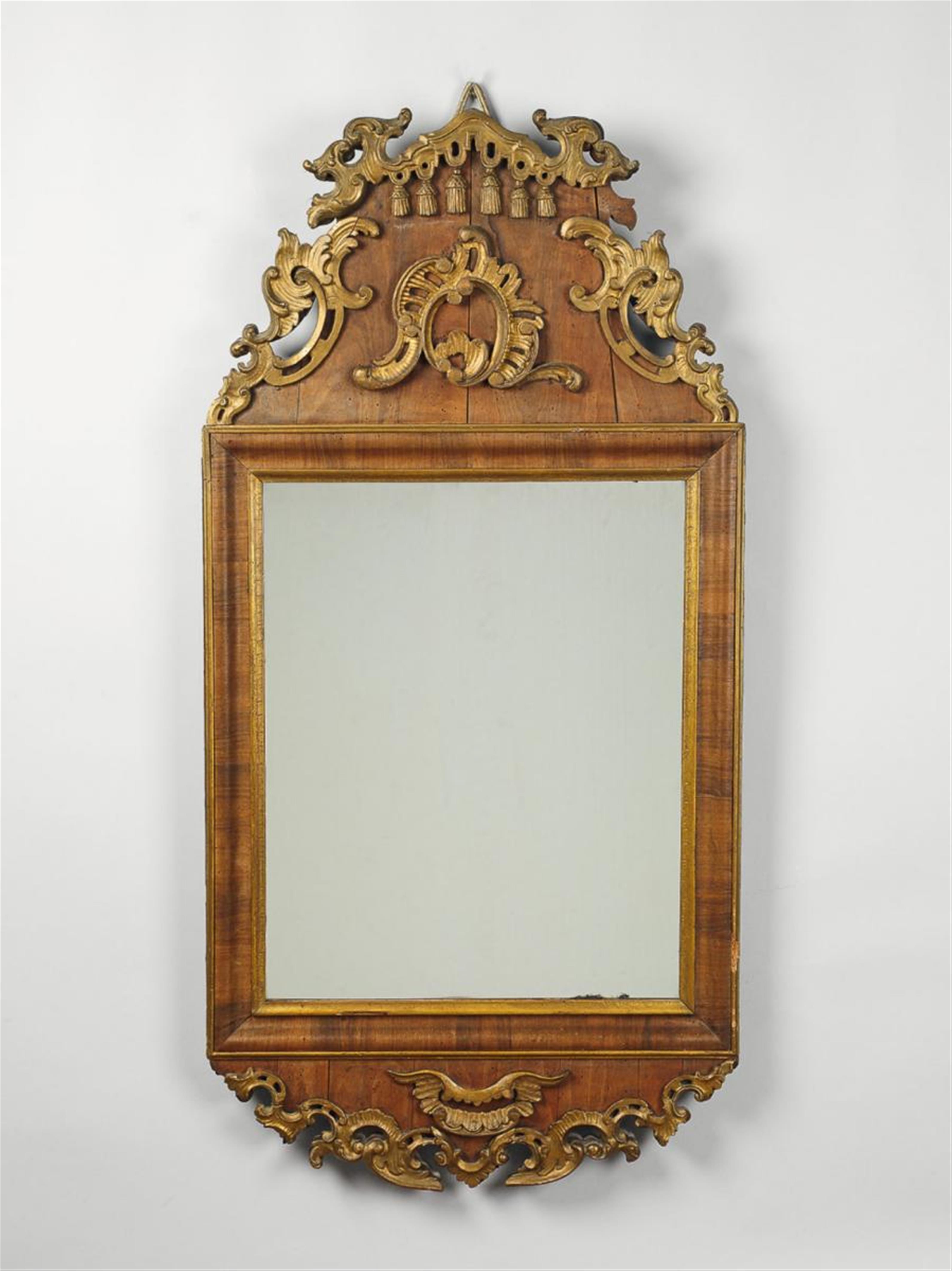 A small German or Scandinavian walnut veneered softwood mirror with gilt relief appliques. - image-1