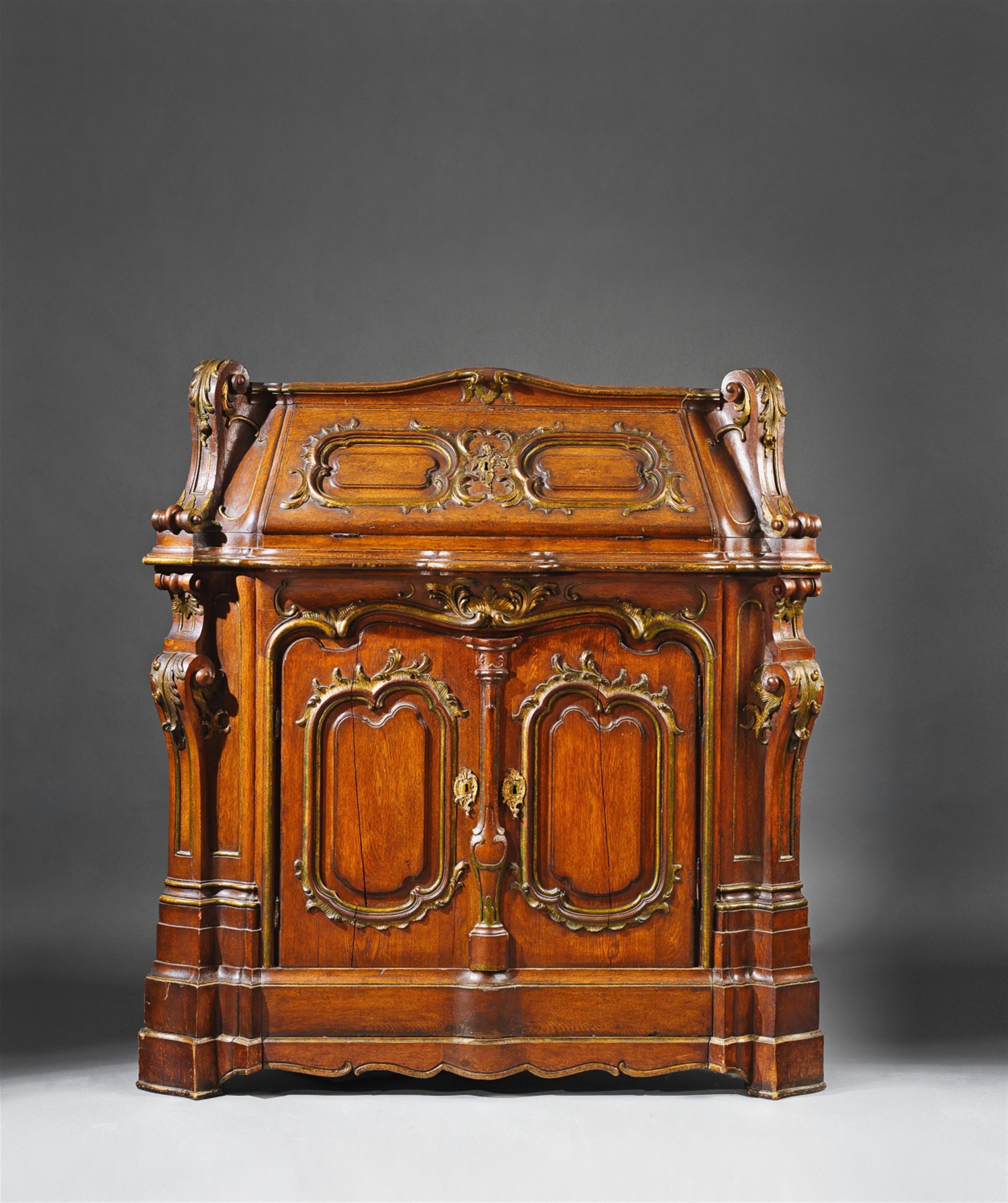 A Mainz ormolu mounted carved oak corner secretaire. - image-1