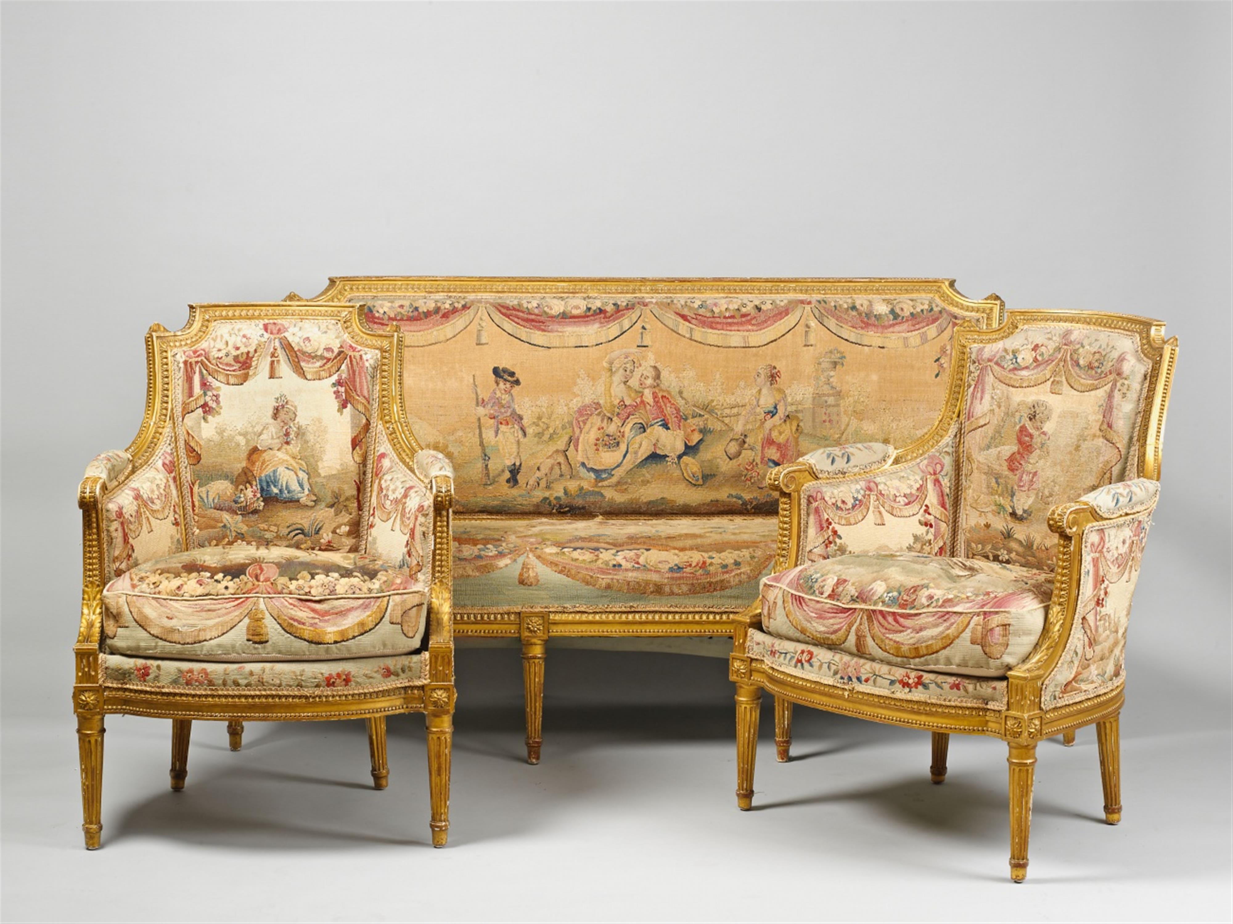 An ensemble of a French giltwood settee and two armchairs. - image-2