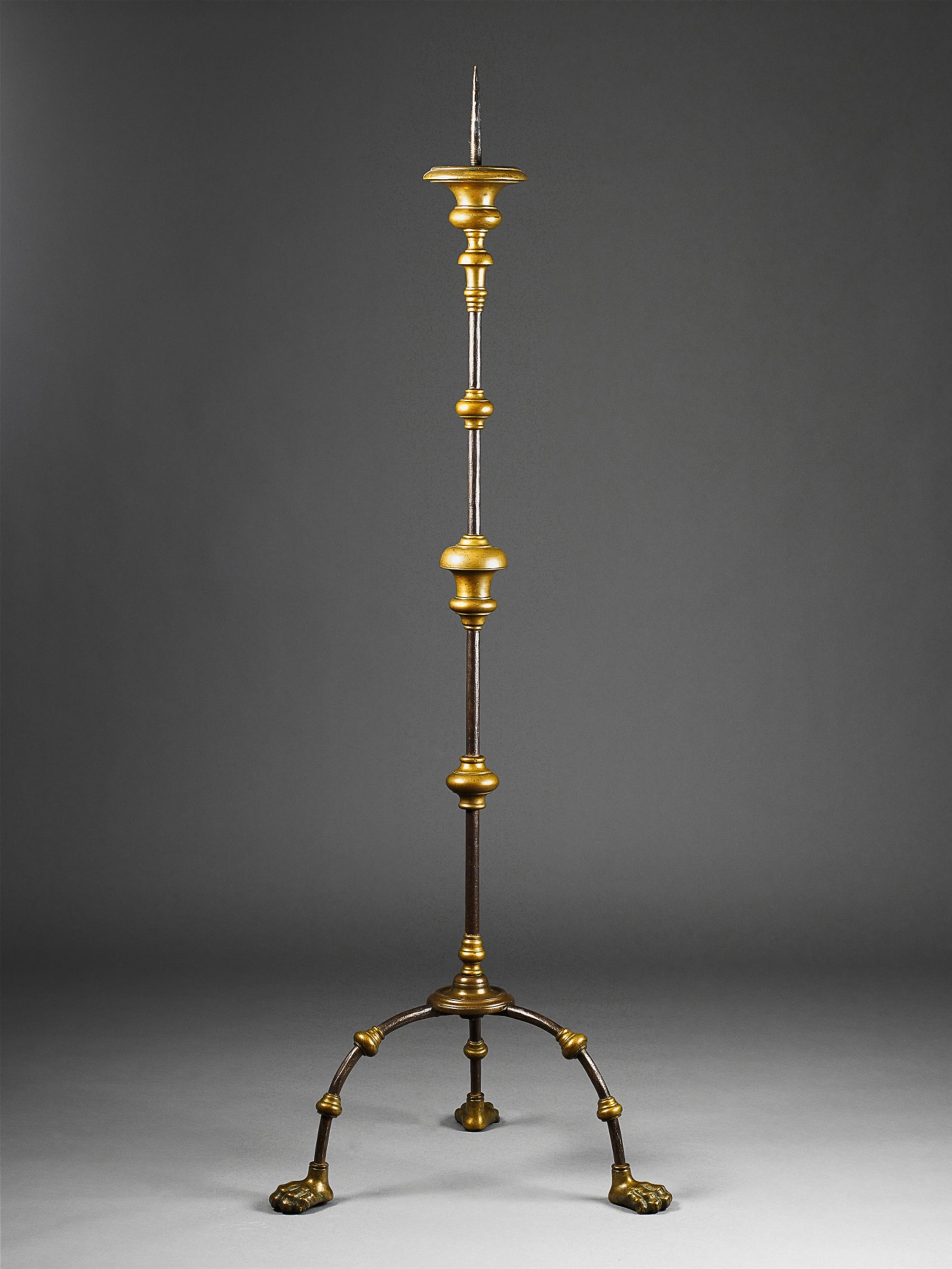 A large iron and bronze standing lamp. - image-1