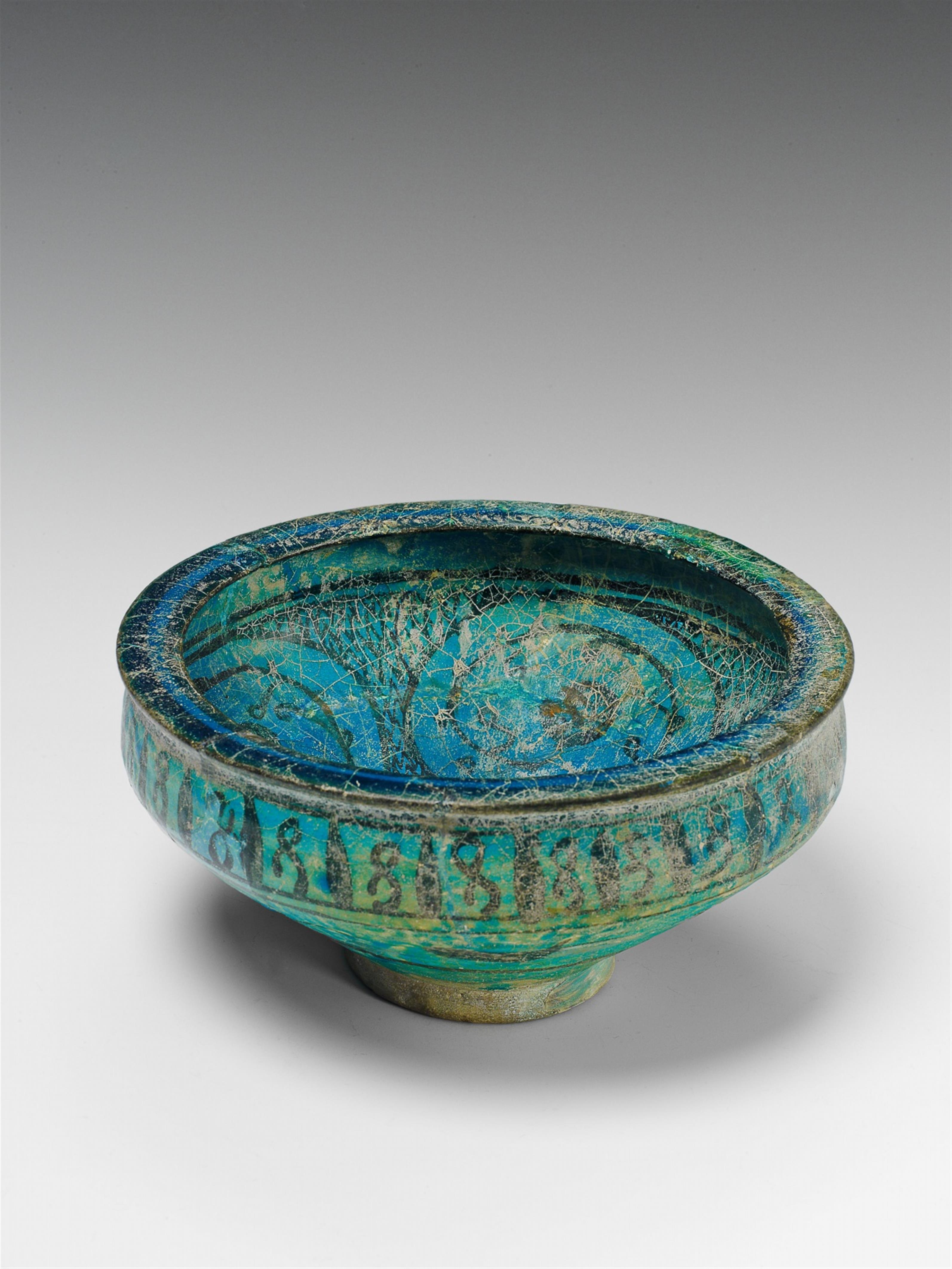 An Iranian turquoise glazed ceramic bowl. - image-1