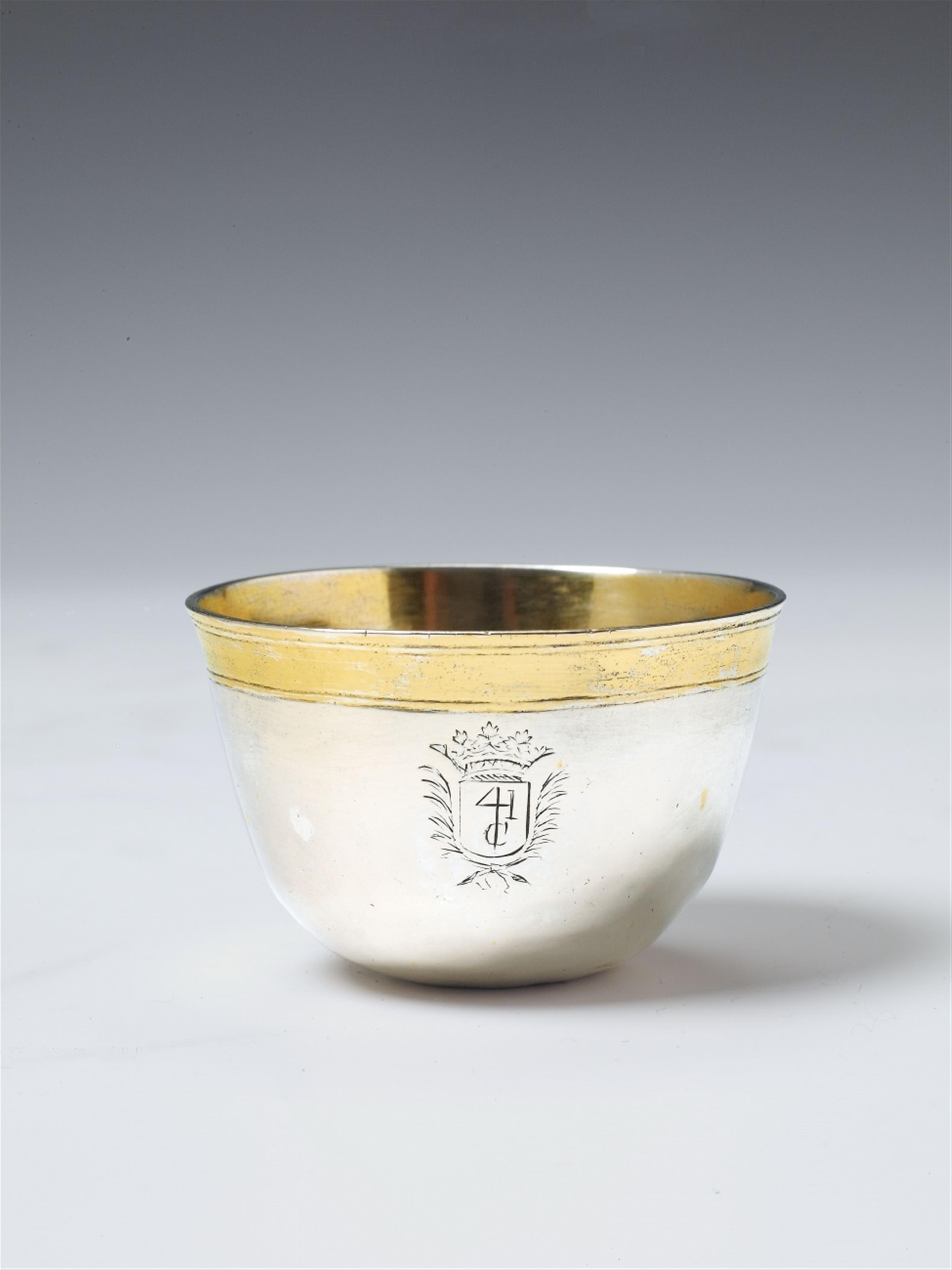 A Cologne silver partially gilt tumbler. Engraved with a crowned coat of arms. Marks of Caspar Melchior Noth, ca. 1750. - image-1