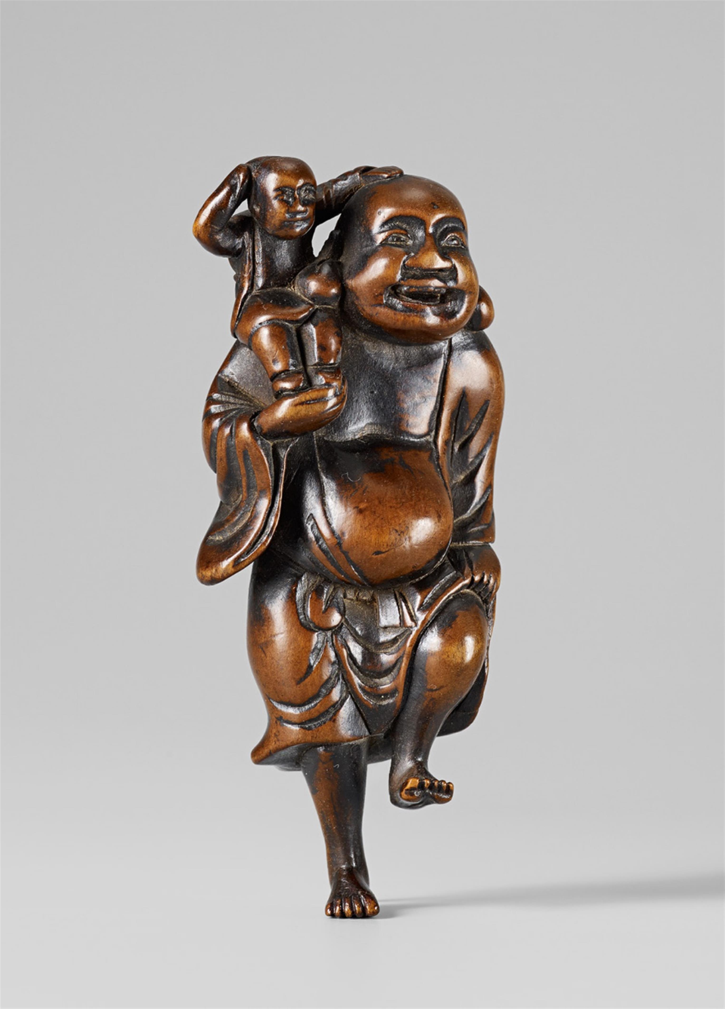 A large boxwood netsuke of Hotei shouldering a karako. Late 18th century - image-1