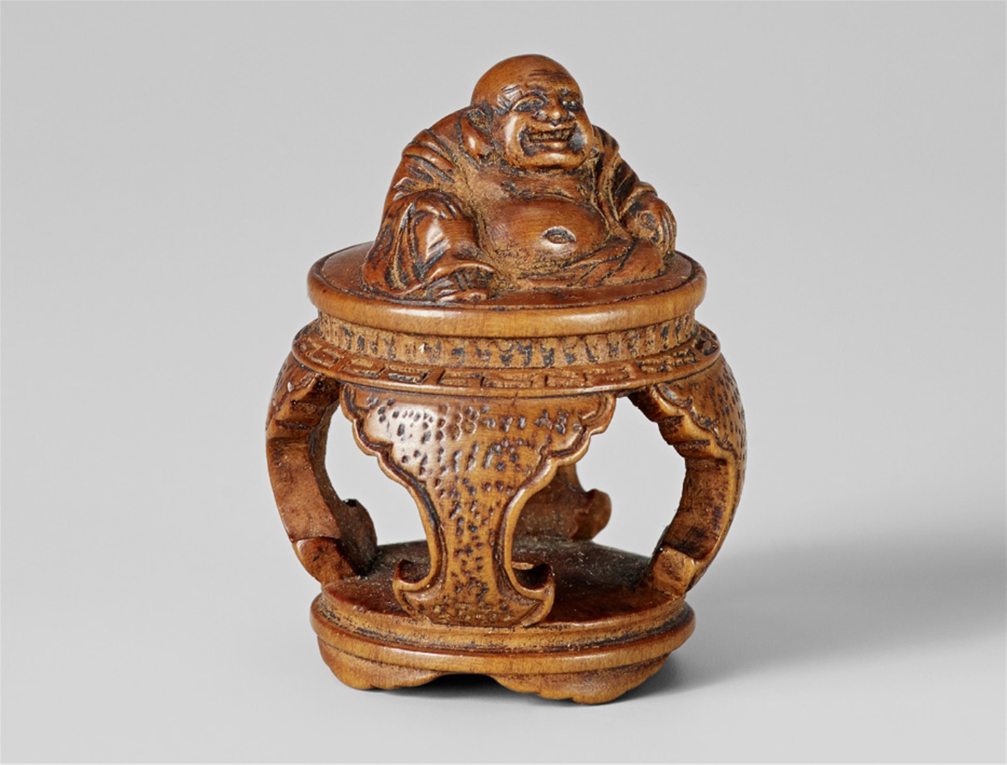 A small boxwood netsuke of Hotei, by Tomochika. Mid-19th century - image-1