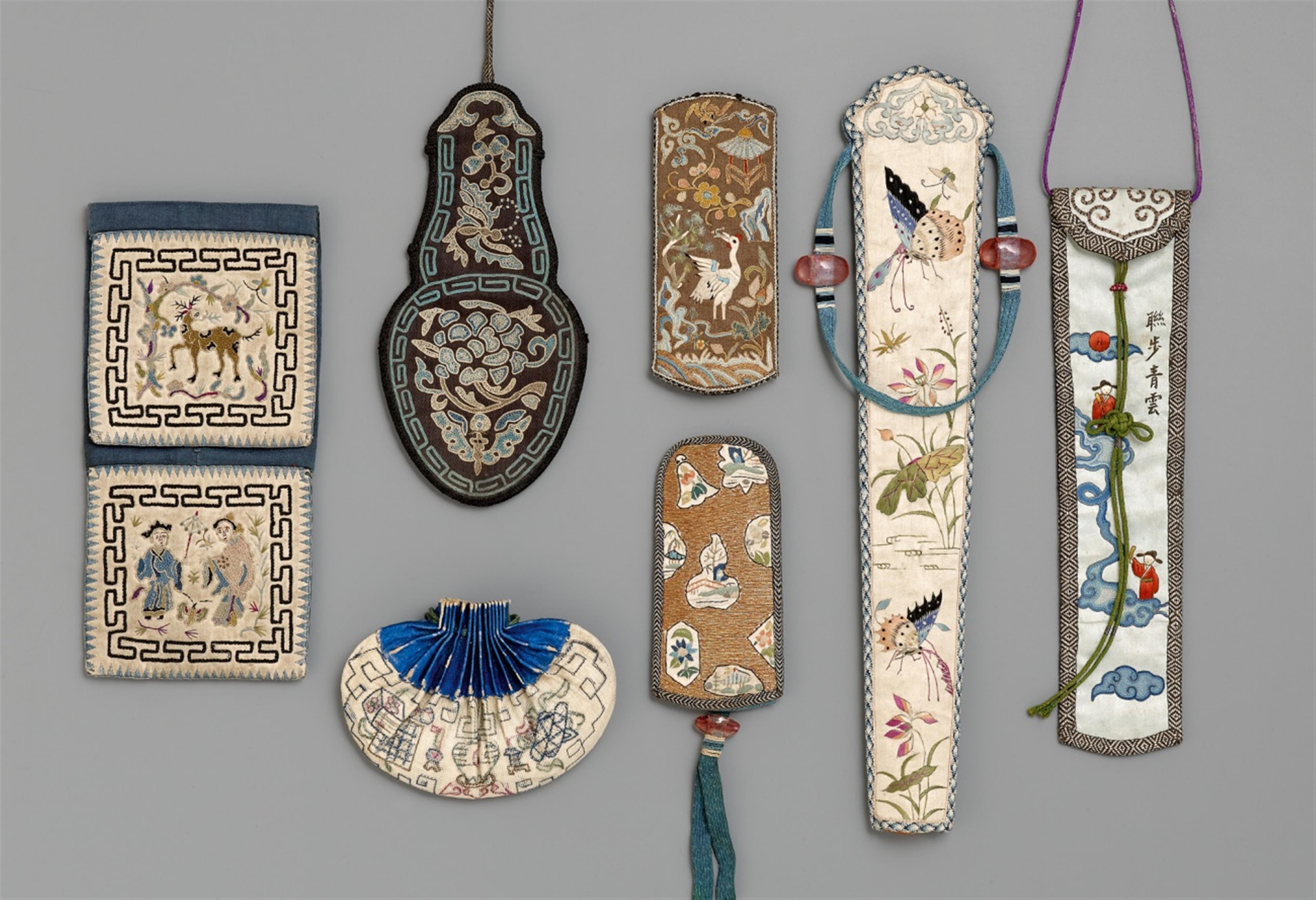 Seven small embroidered pouches of satin, cotton and card board. Around 1900 - image-1