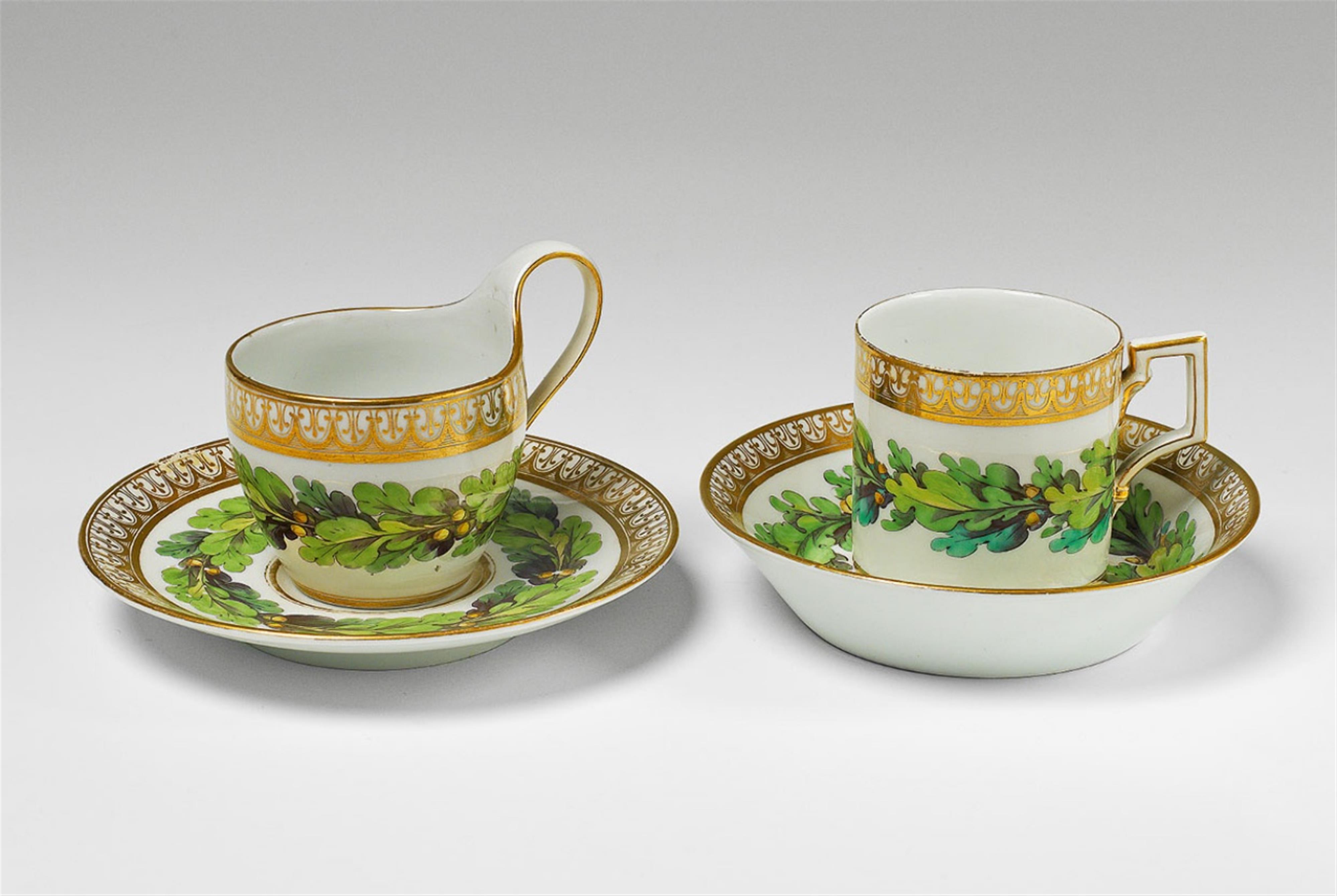 Two Berlin KPM porcelain cups and saucers with oak leaf decor. - image-1