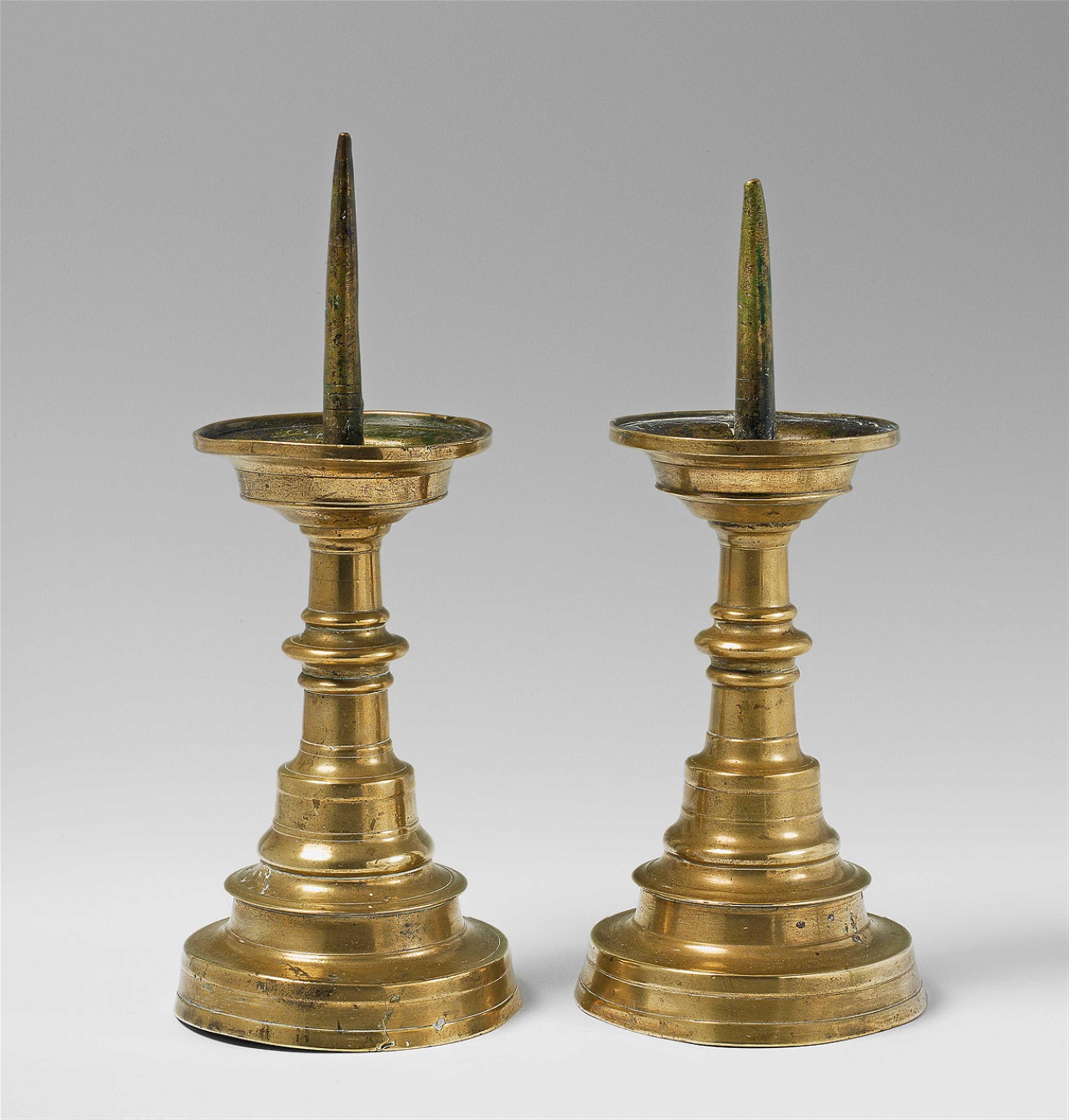 A pair of cast bronze late Gothic candlesticks. - image-1