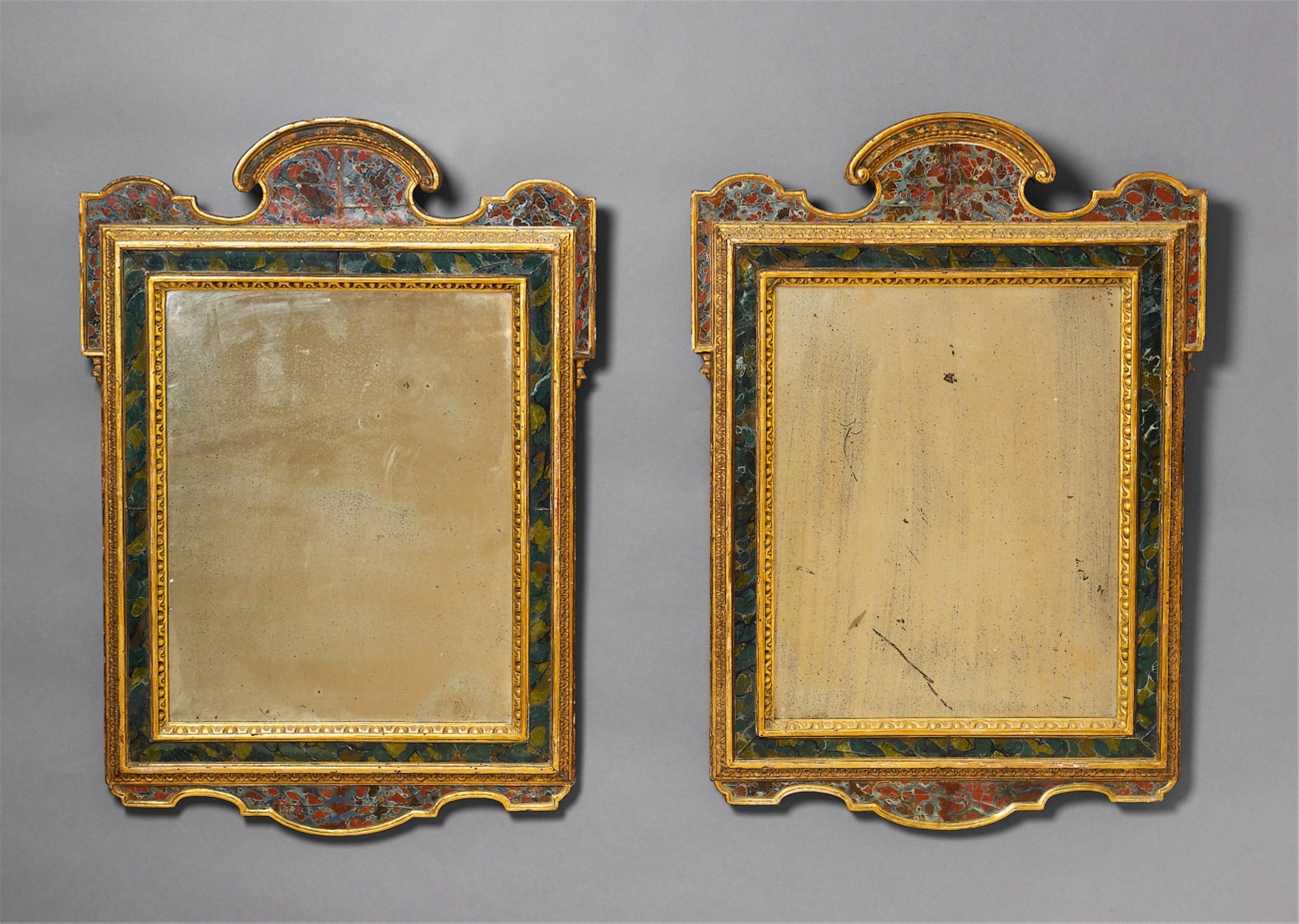 A pair of Baroque style carved giltwood mirrors with reverse glass painted decor. - image-1