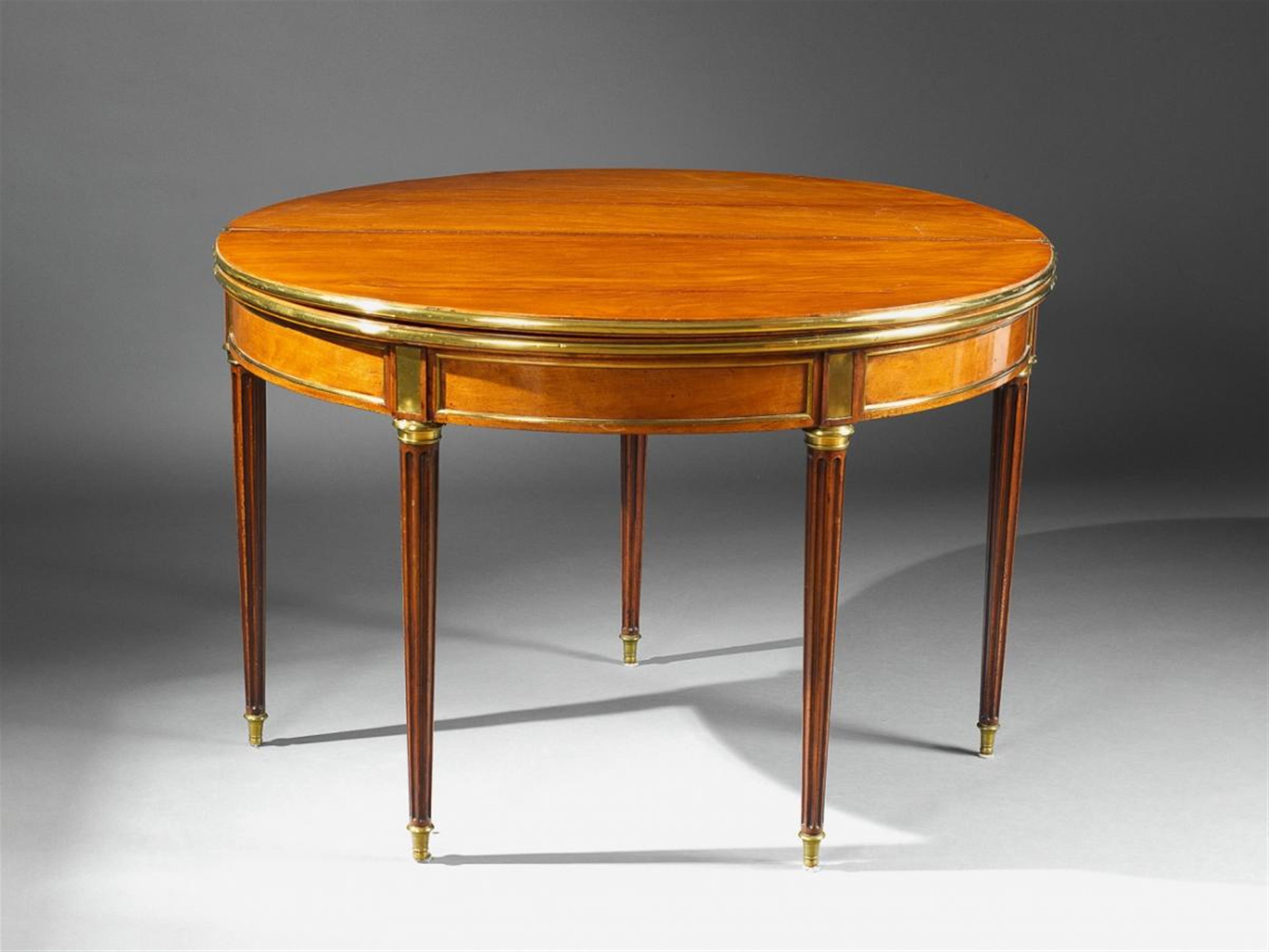 A Neoclassical brass-mounted mahogany convertible table. - image-1