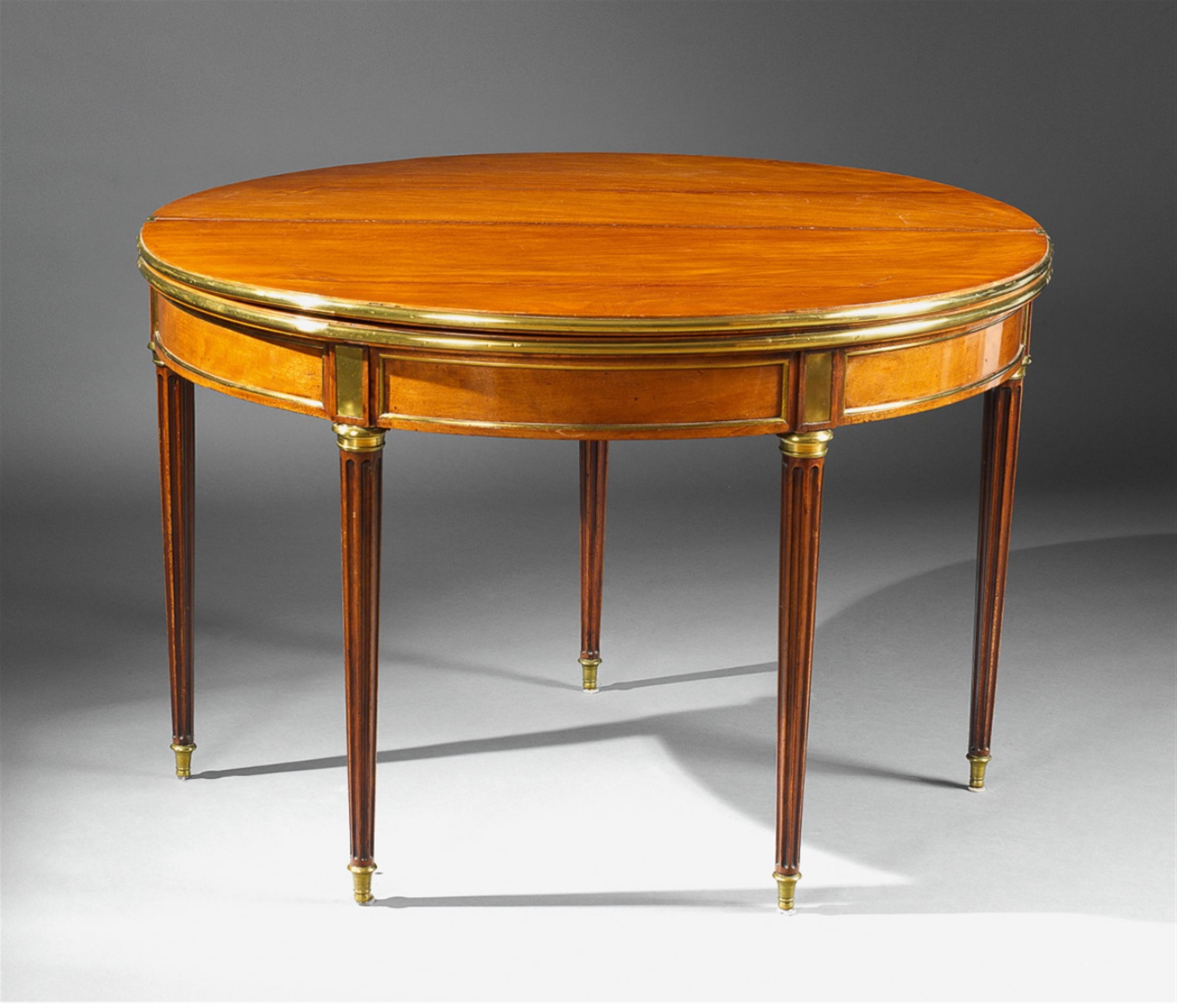 A Neoclassical brass-mounted mahogany convertible table. - image-2