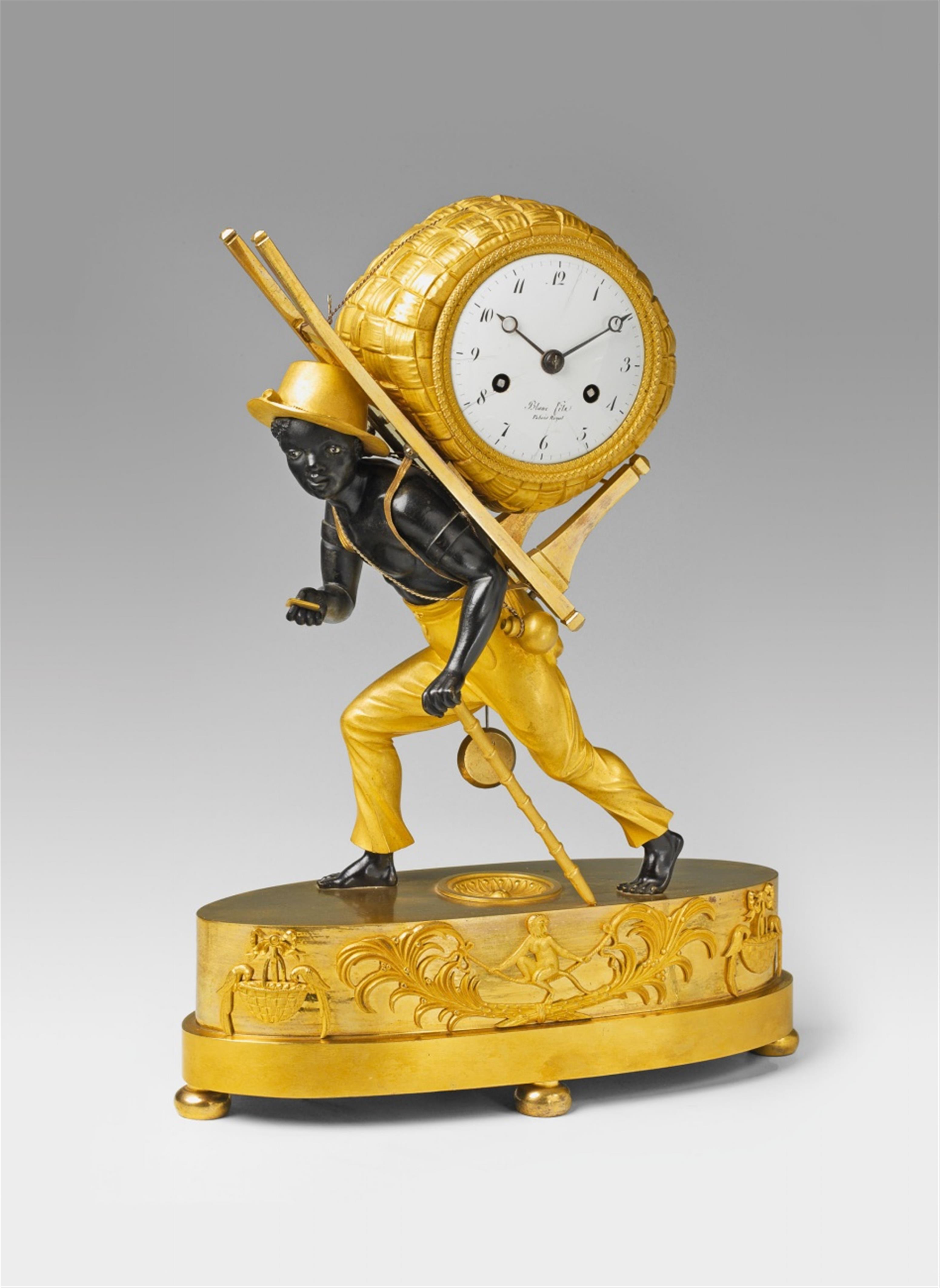 A Parisian ormolu pendulum clock formed as a figure carrying cotton. - image-1