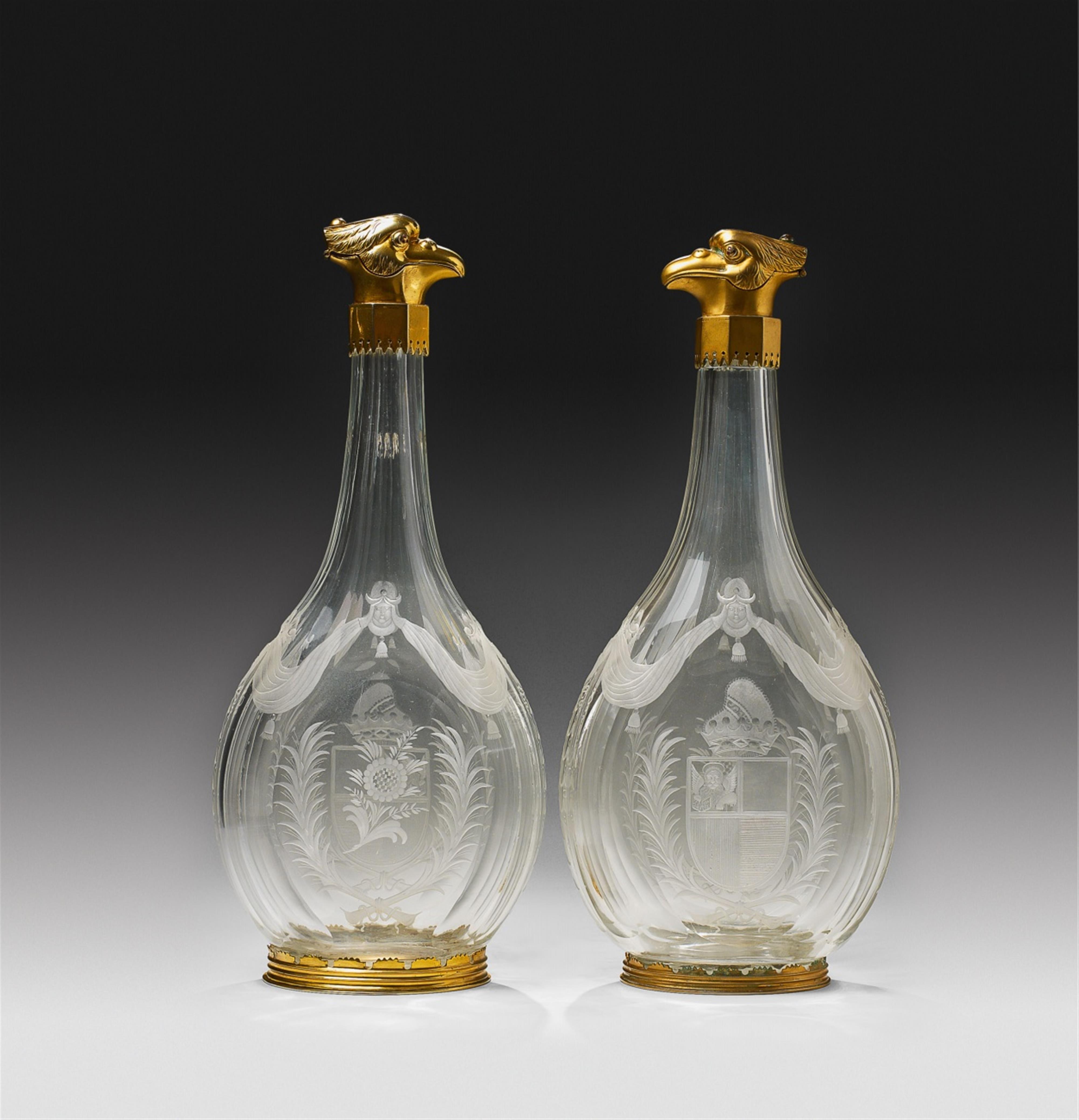 A pair of important ormolu mounted Venetian cut glass carafes. - image-1