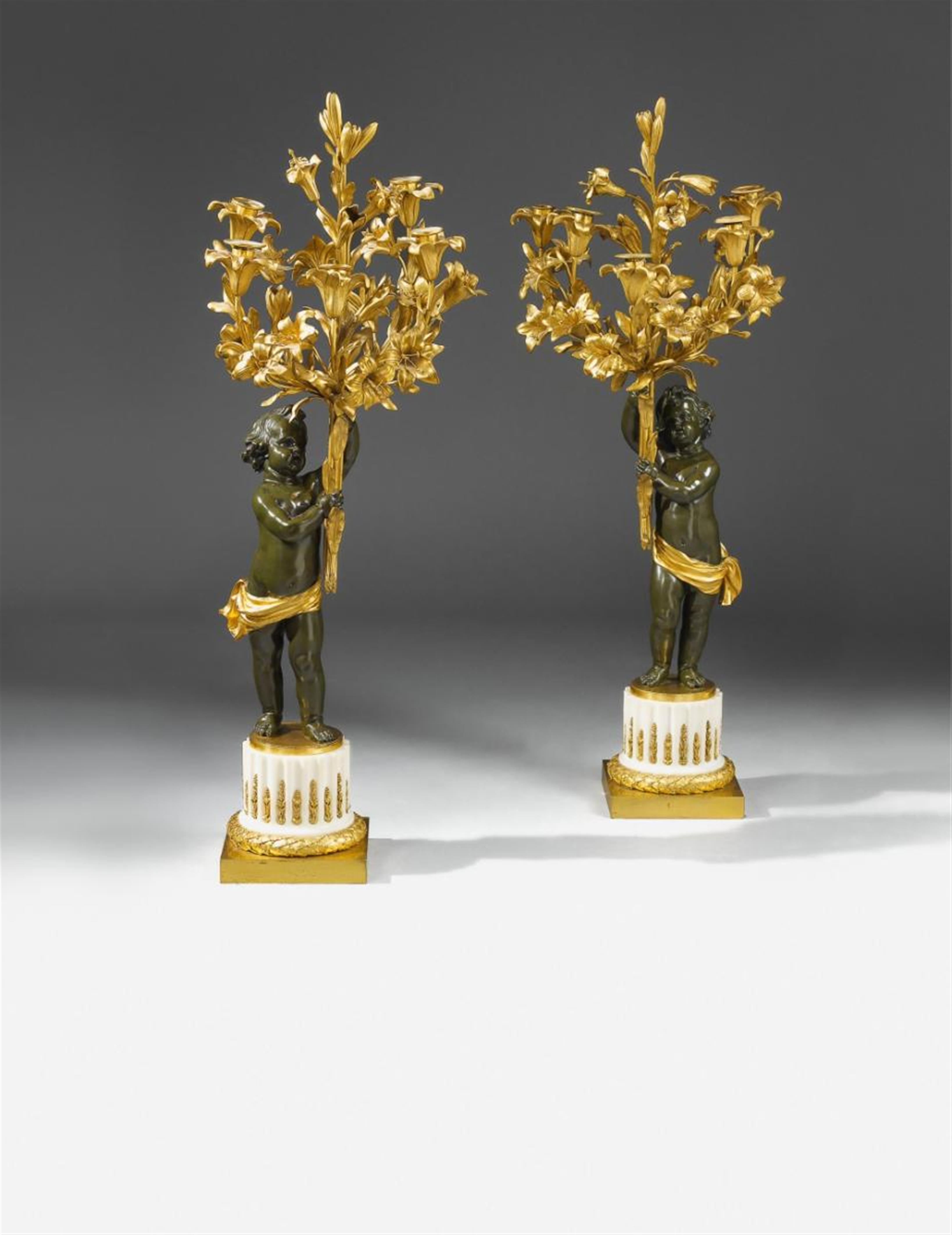 A pair of Parisian fire-gilt and burnished bronze candelabra. - image-1
