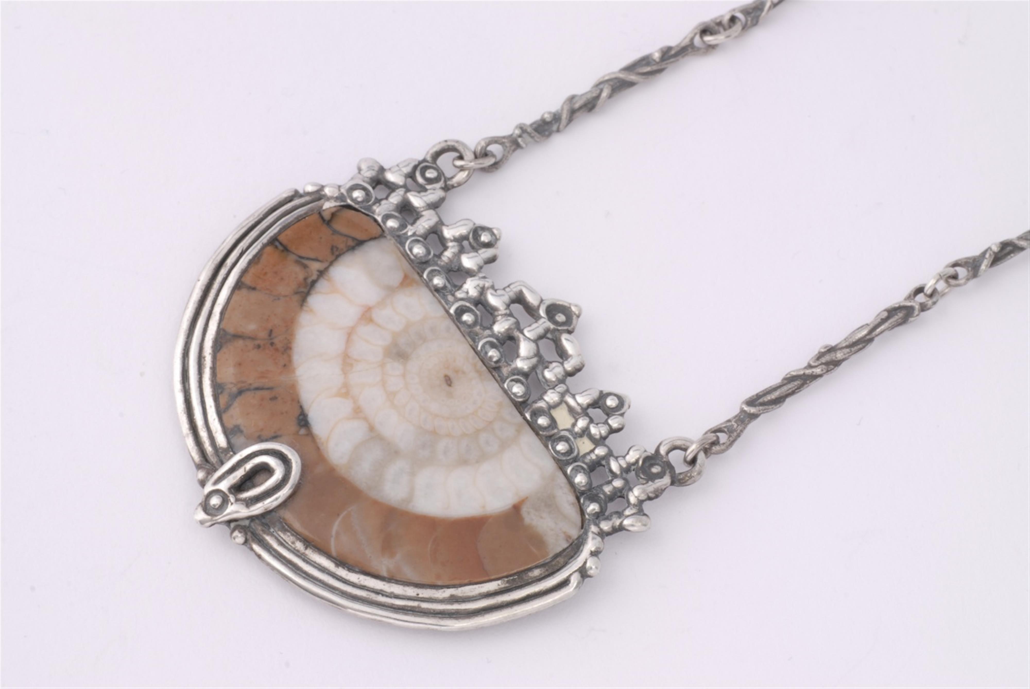 An Arts and Crafts style sterling silver collier with an ammonite pendant. - image-1