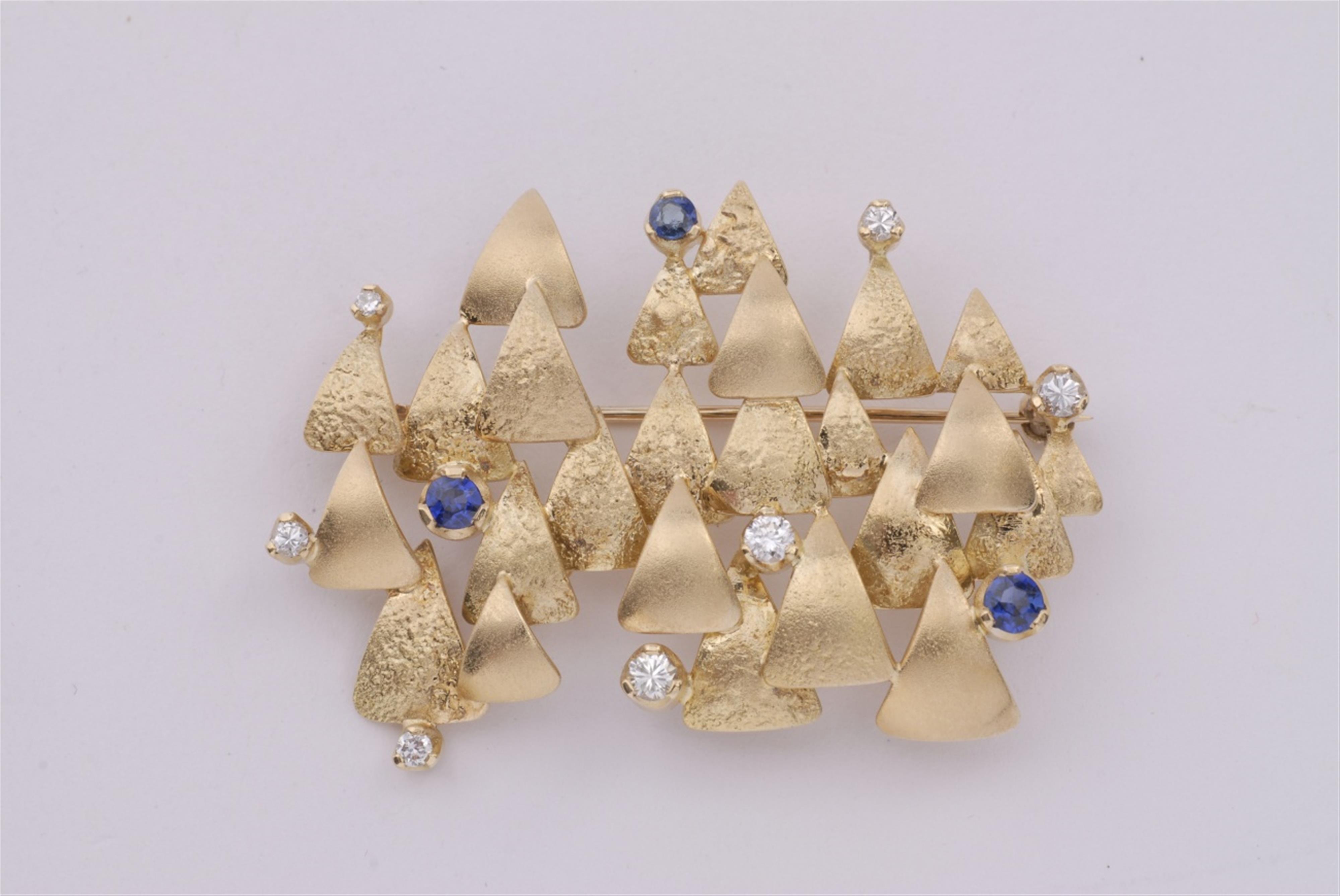 An 18k gold, diamond and sapphire brooch. - image-1