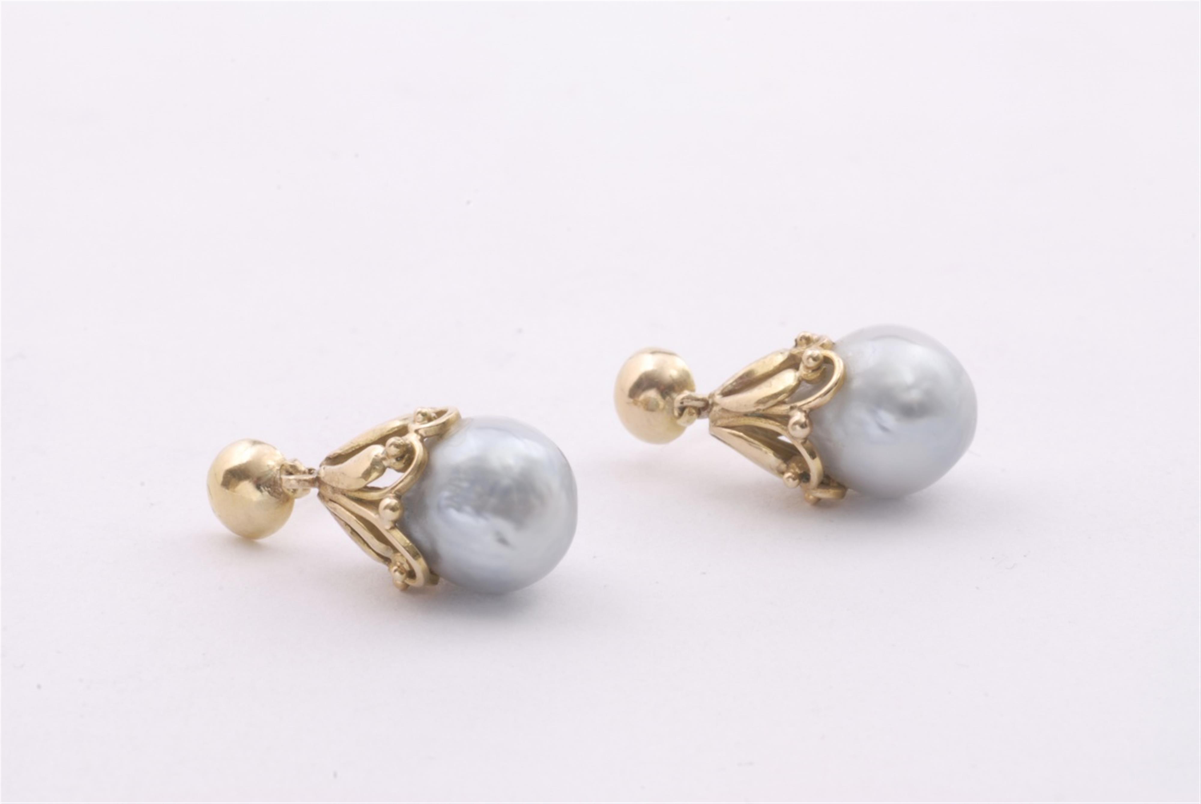 A pair of 18k gold and pearl pendant earrings. - image-1