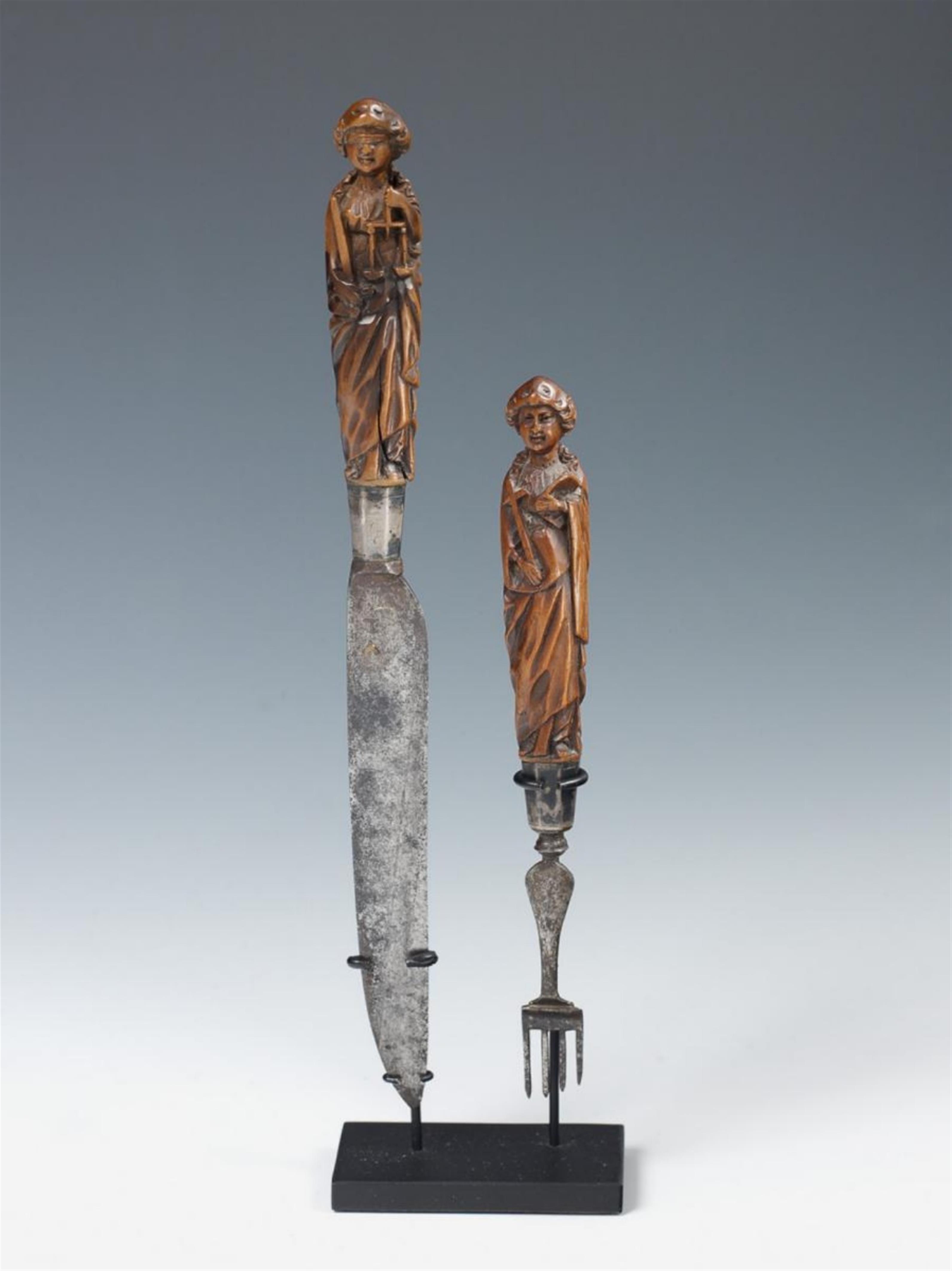 A knife and fork with wooden handles carved as Justitia and Fides - image-1